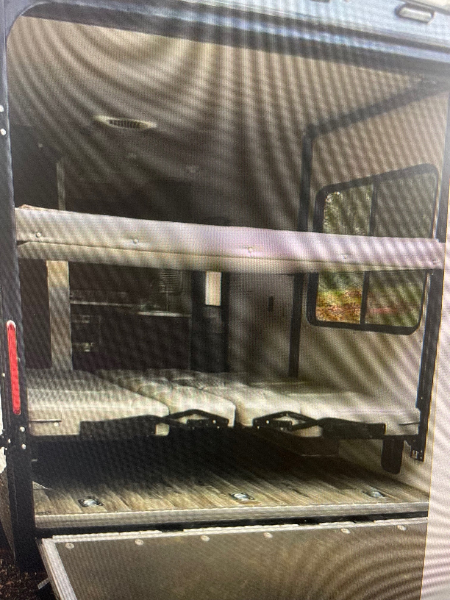 Ramp dropped with pull down screen down so you can enjoy the scenery while relaxing inside the trailer . Lower Queen been converts into two couches . Jayco Octane 2018