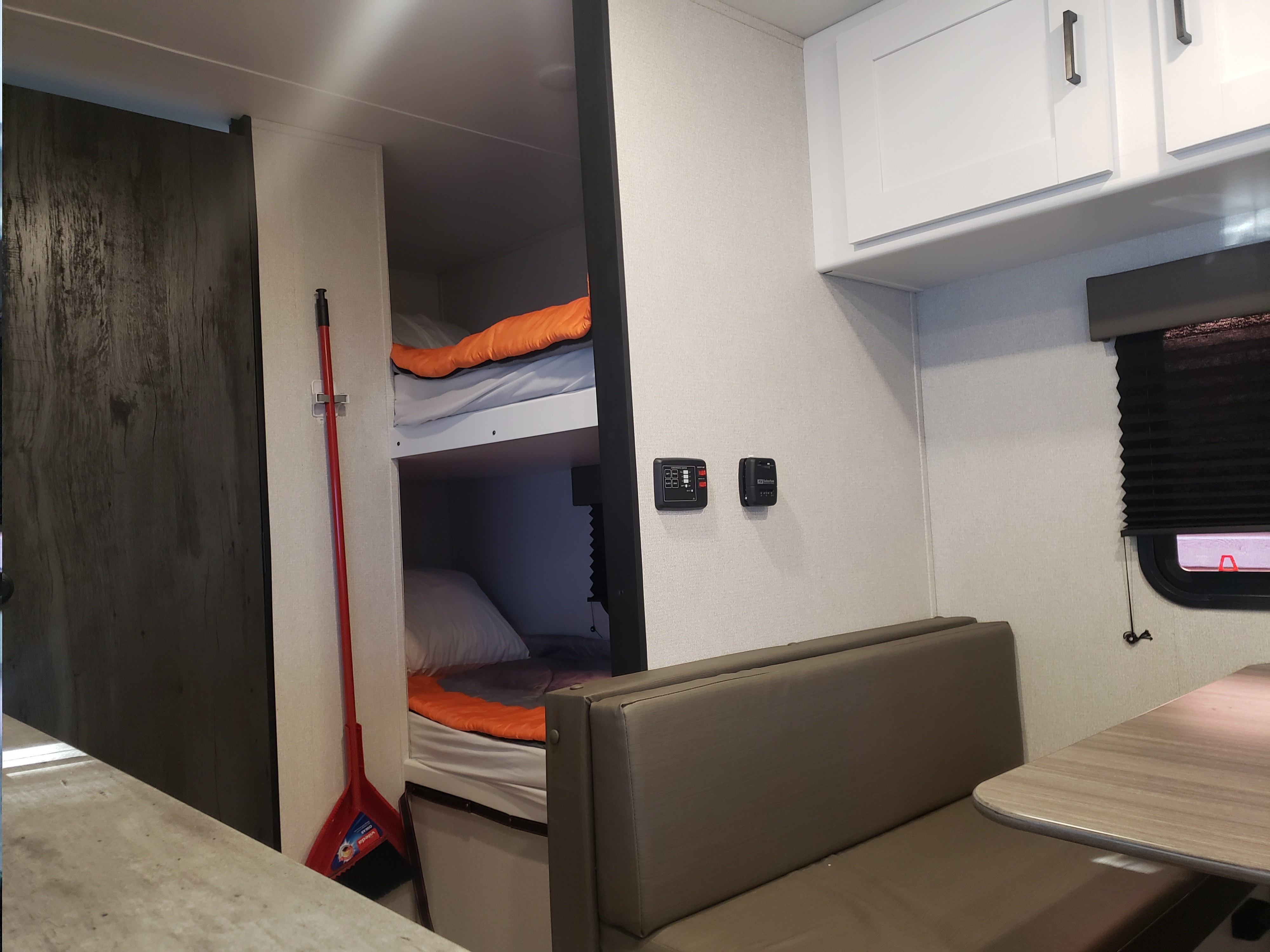 This RV rental offers compact living with bunk beds, a dinette area, and overhead cabinets for storage.. Keystone RV Hideout 2022