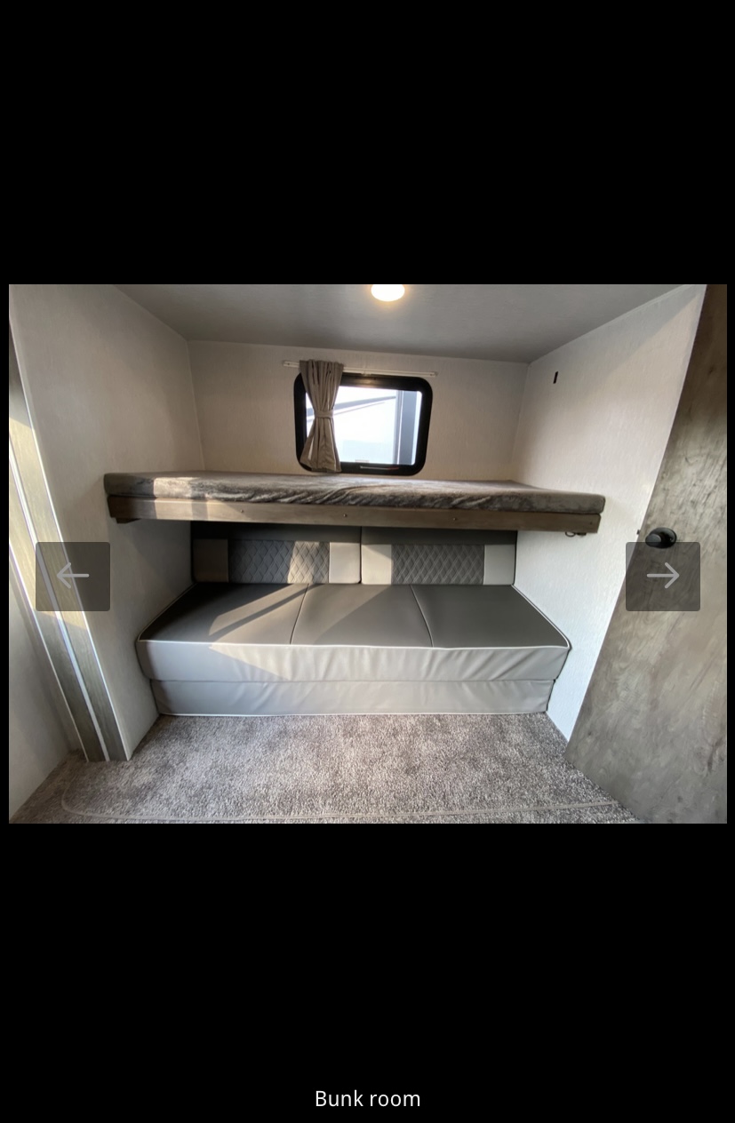RV rental bunk room with an upper bed and a lower convertible sofa/bed. Compact and functional sleeping space.. Forest River Salem 2022