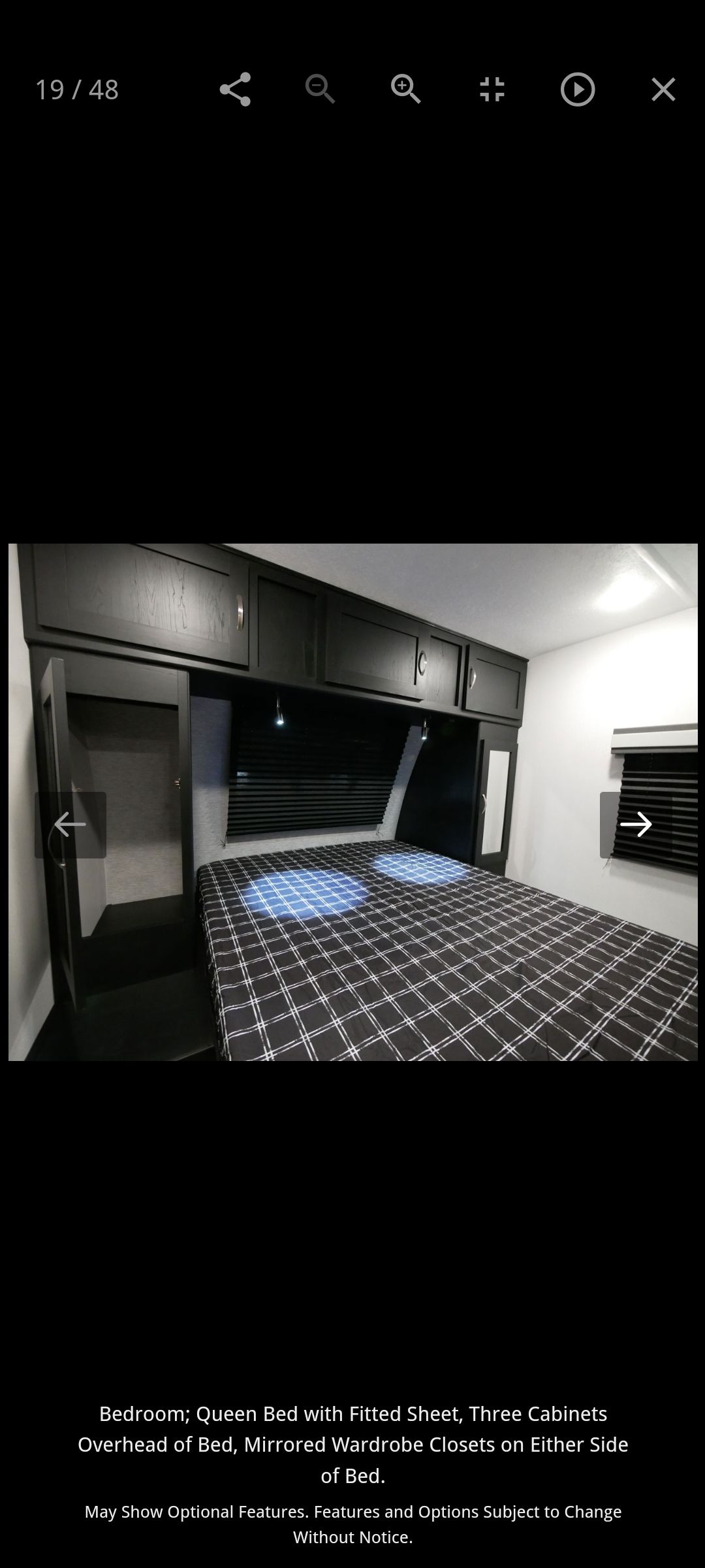 RV rental bedroom: Queen bed, overhead cabinets, and mirrored wardrobes for compact comfort.. Forest River Coachmen Freedom Express Ultra Lite 2022