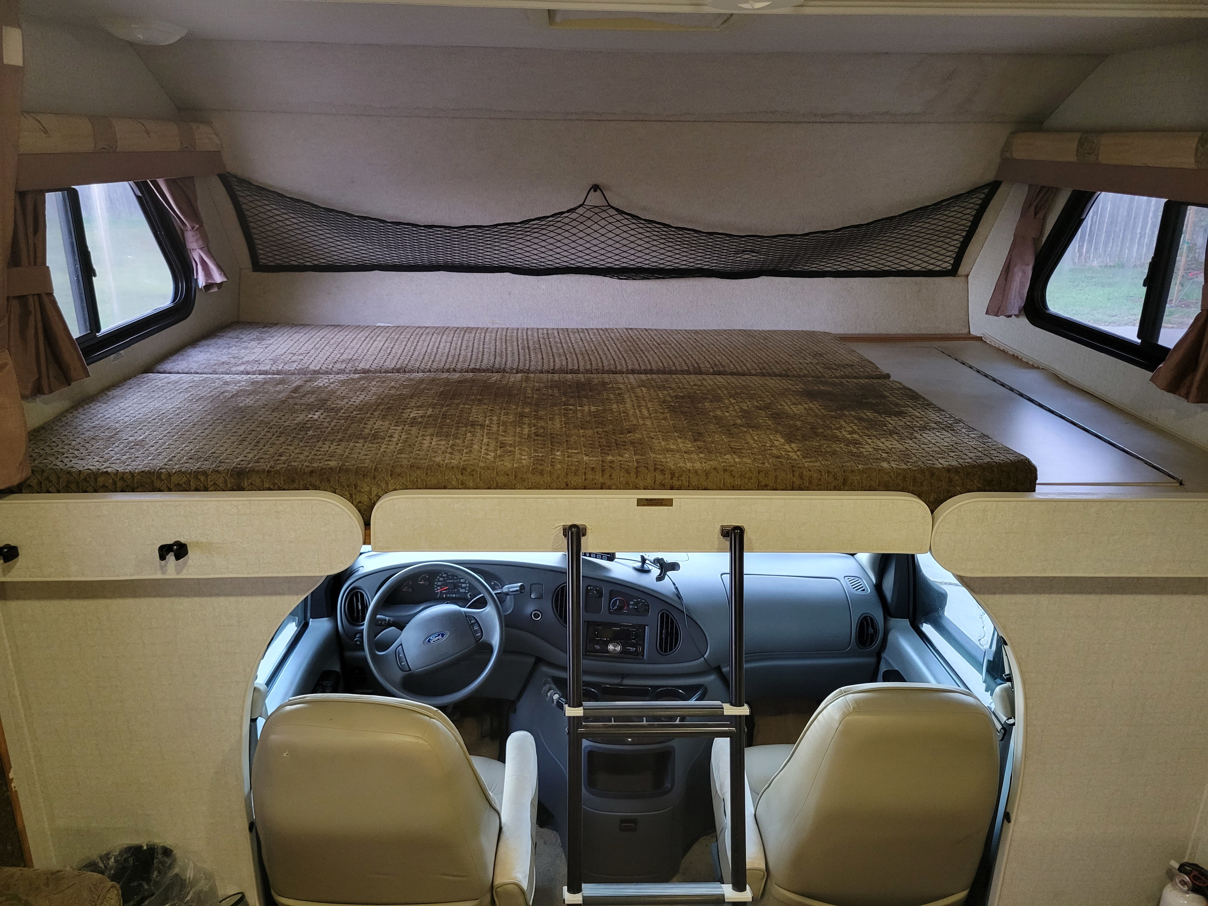 Queen bed over cab, with privacy curtains.. Tioga Tioga Motorhome 2005