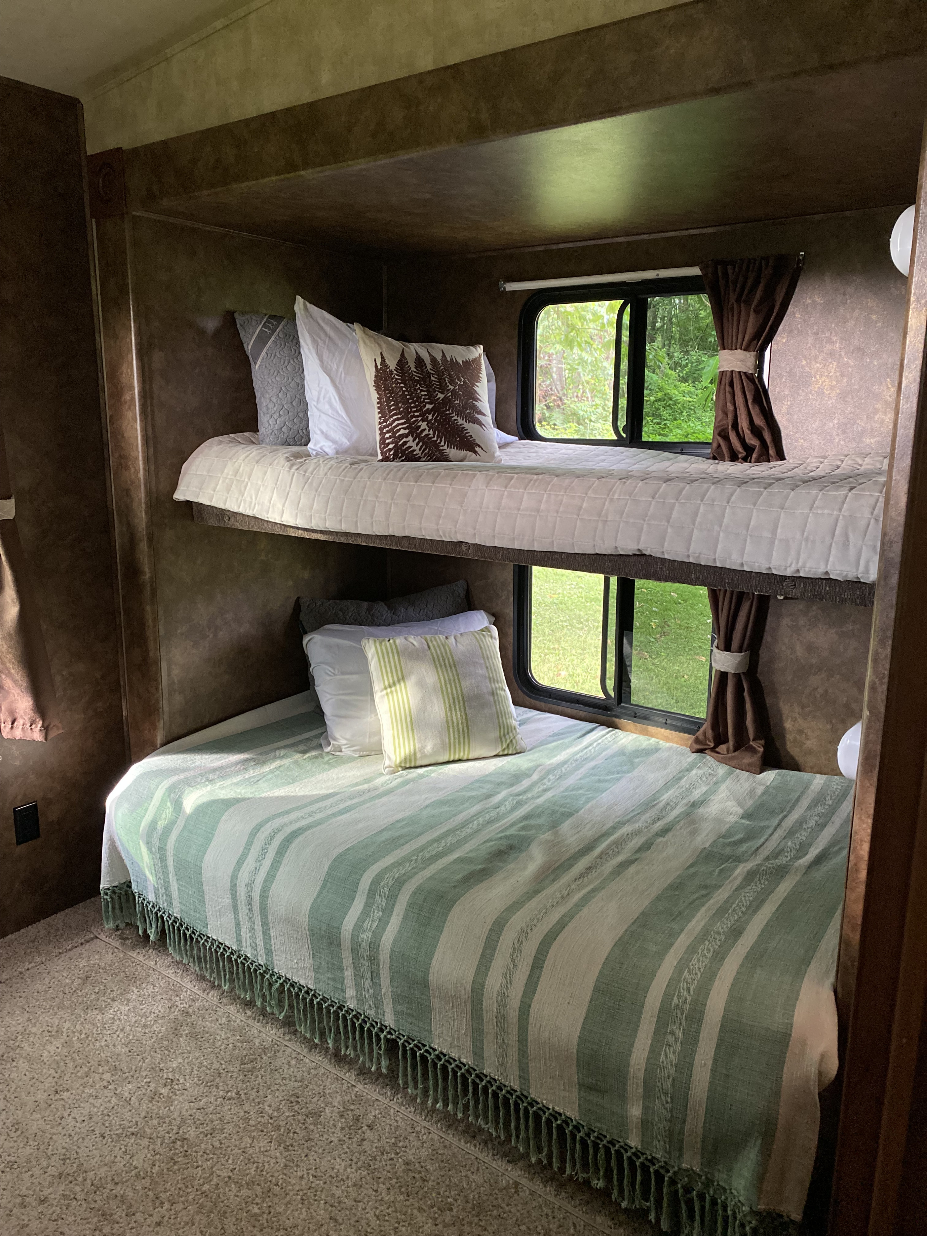 Back Bedroom, Separate from Living Space, has own bathroom and 3 beds. 
(Items in photos are only staged and are not included in rental.). Forest River Sierra 2014