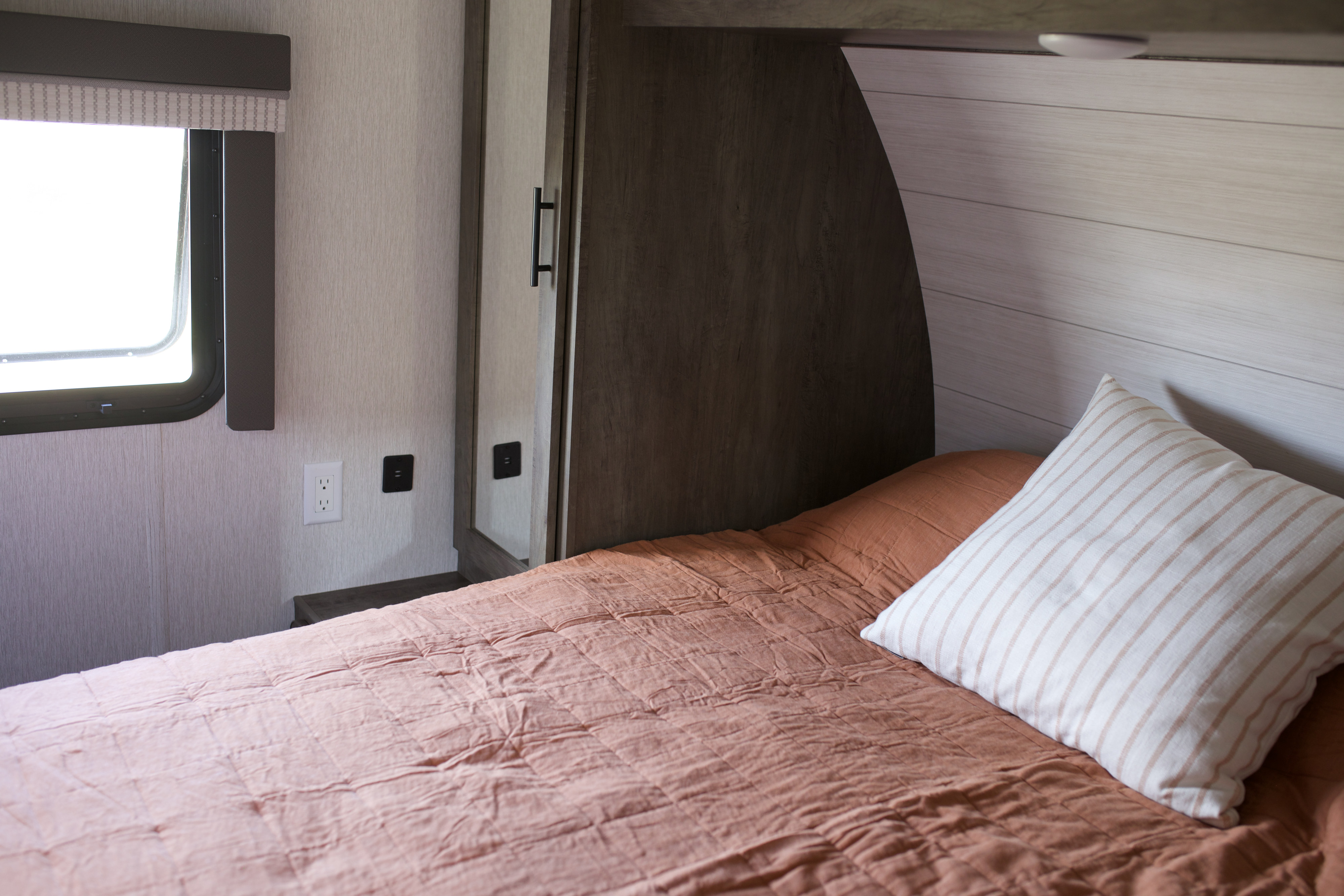 Main bedroom with Queen mattress and storage on both sides and below. Forest River Salem Cruise Lite 2022