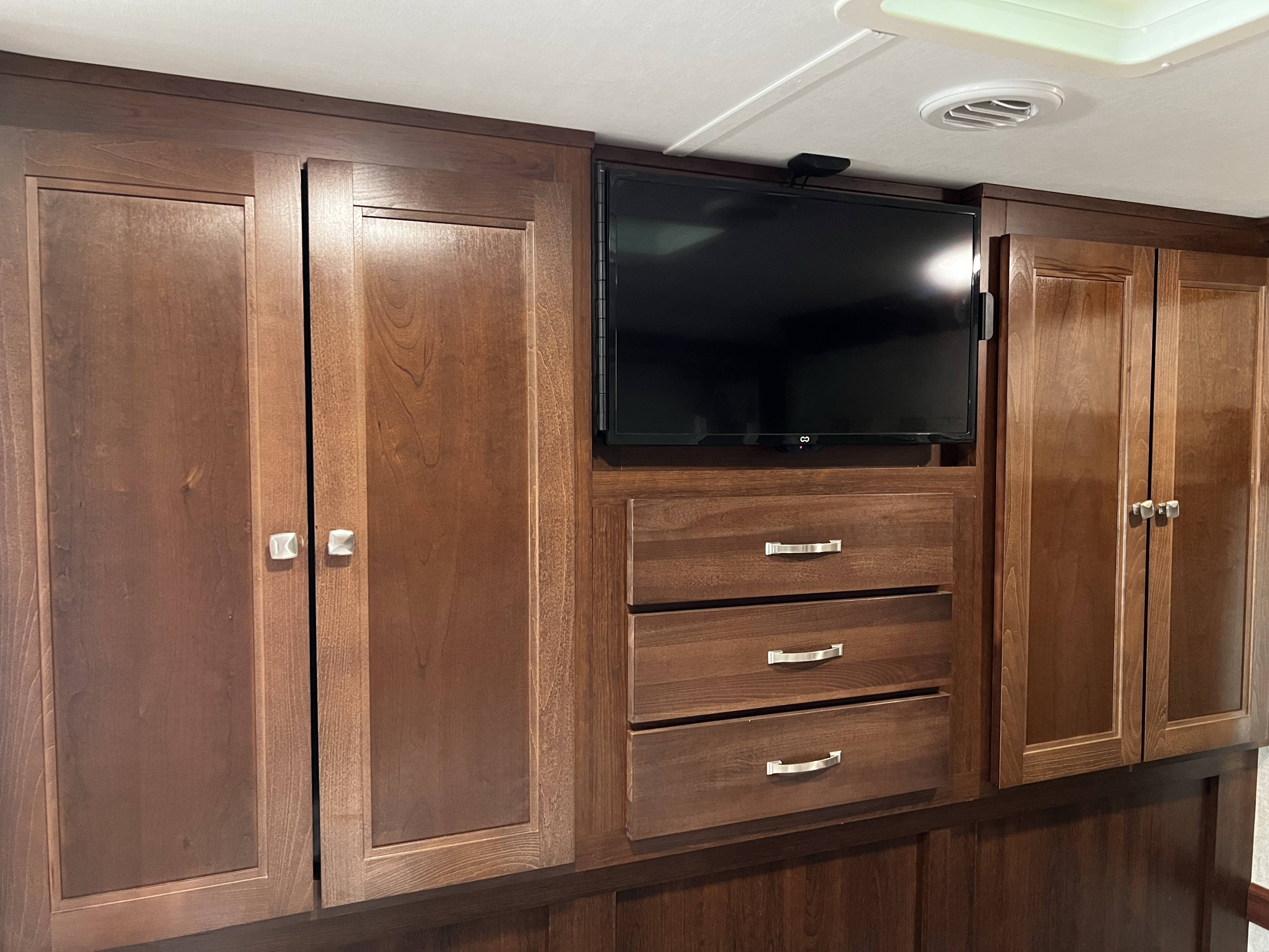 This RV rental's wood cabinetry includes a TV, drawers, and cabinets, offering storage and entertainment for your trip.. Forester Forester Motorhome 2019