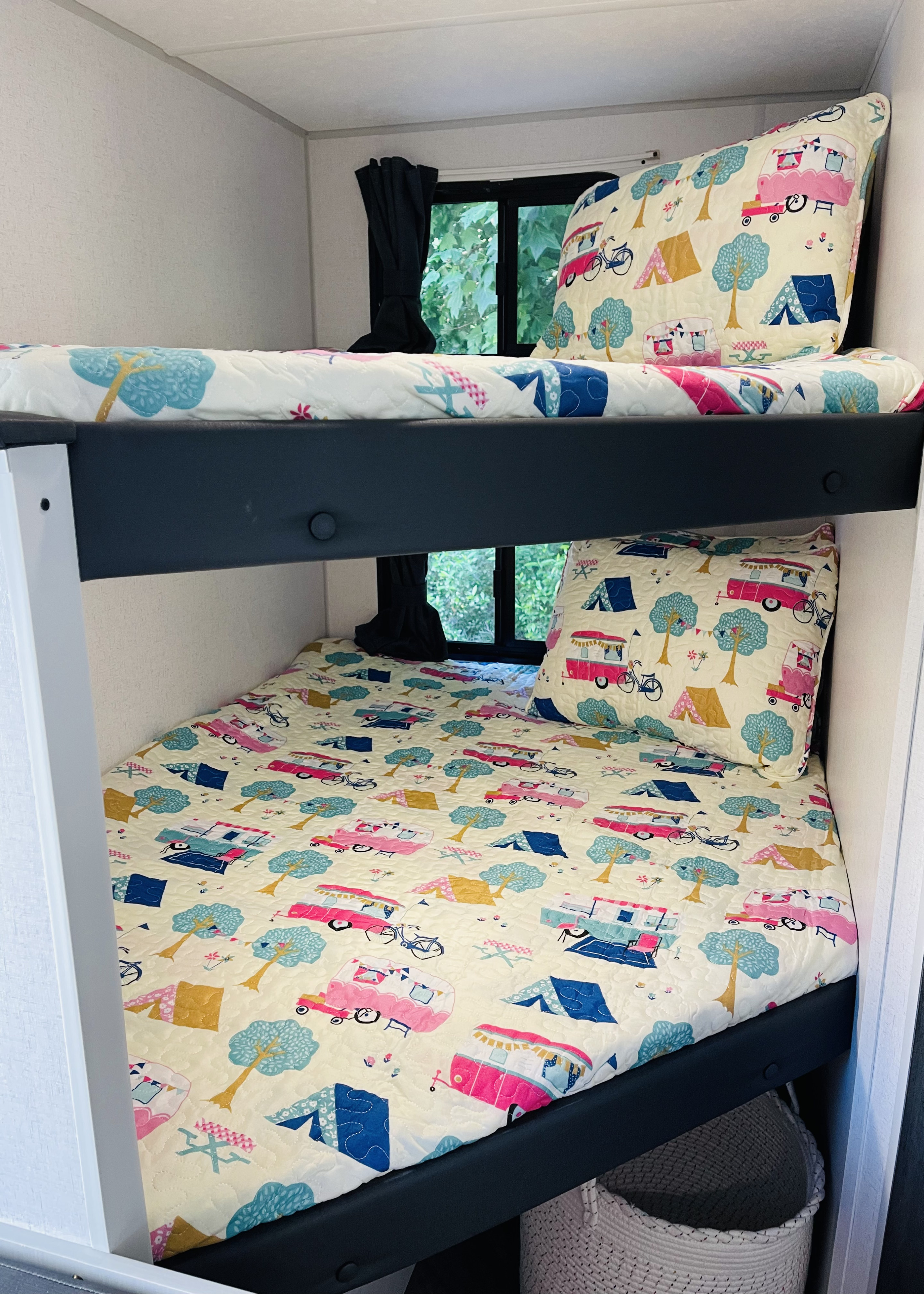 Cozy RV rental bunk beds with fun camping-themed bedding, perfect for family adventures.. Forest River Salem FSX 2022
