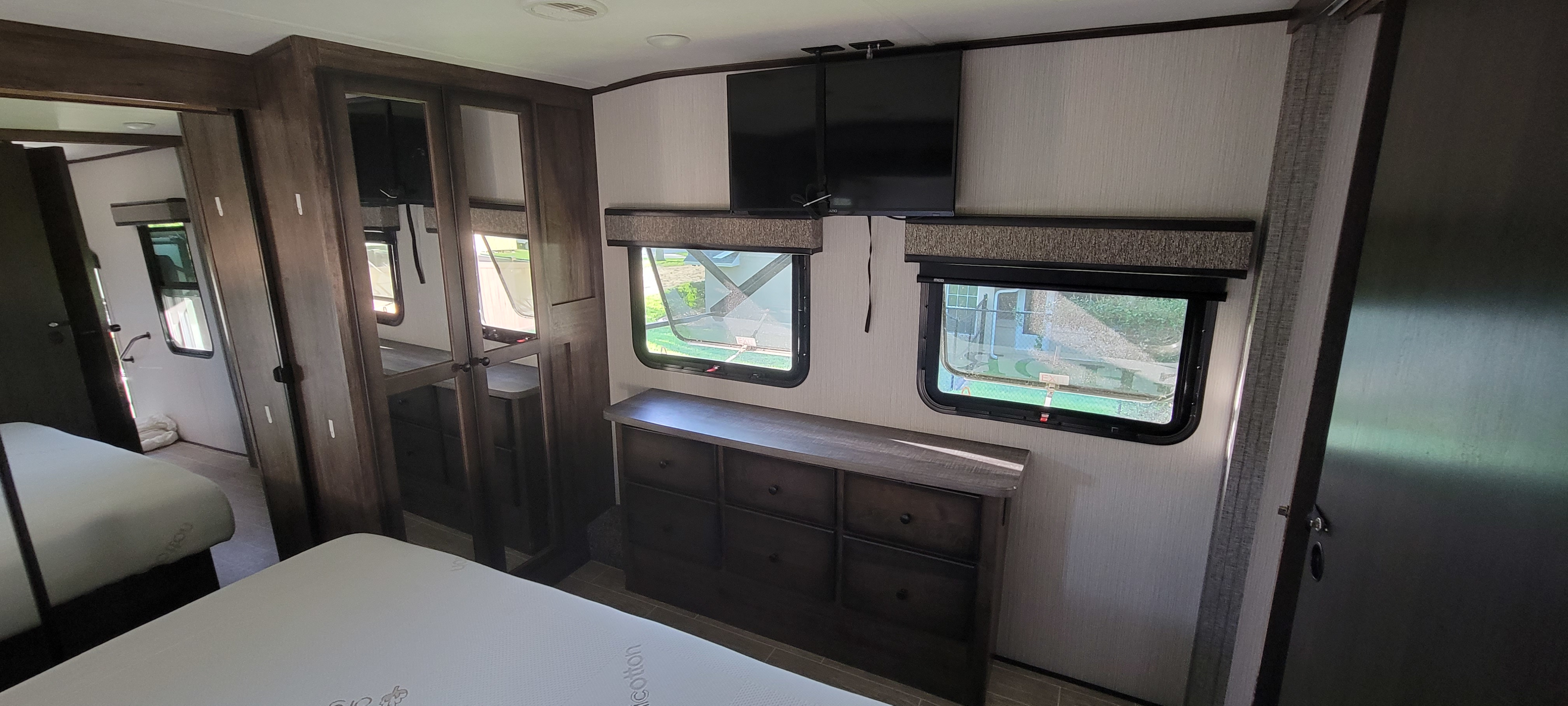 Master bedroom dresser and closet.. Heartland RVs Bighorn Traveler 2021