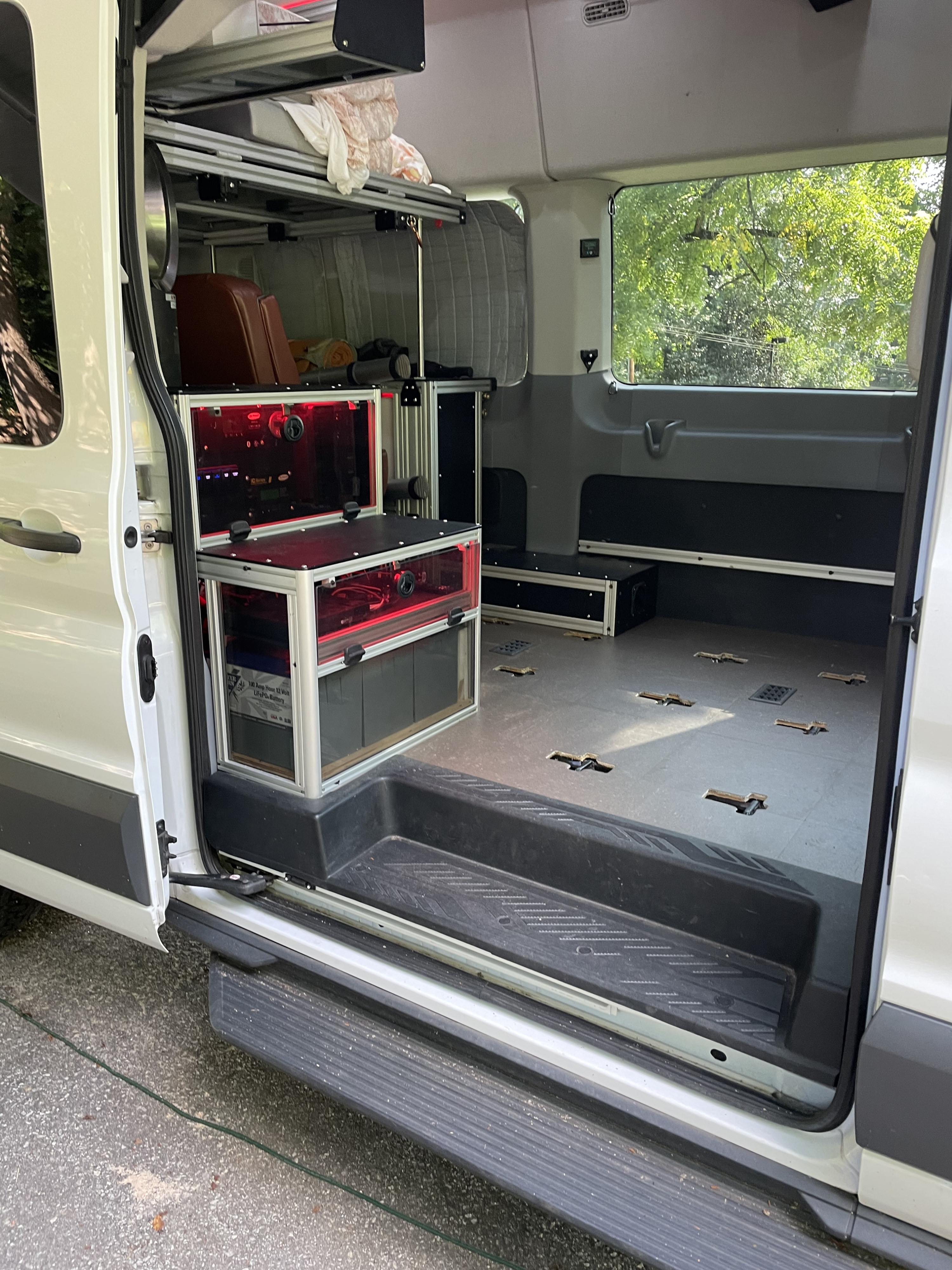 RV rental: Custom van interior with modular bed, visible LiFePo battery power, and versatile anchor-point floor.. Vandoit Vandoit Class B 2017
