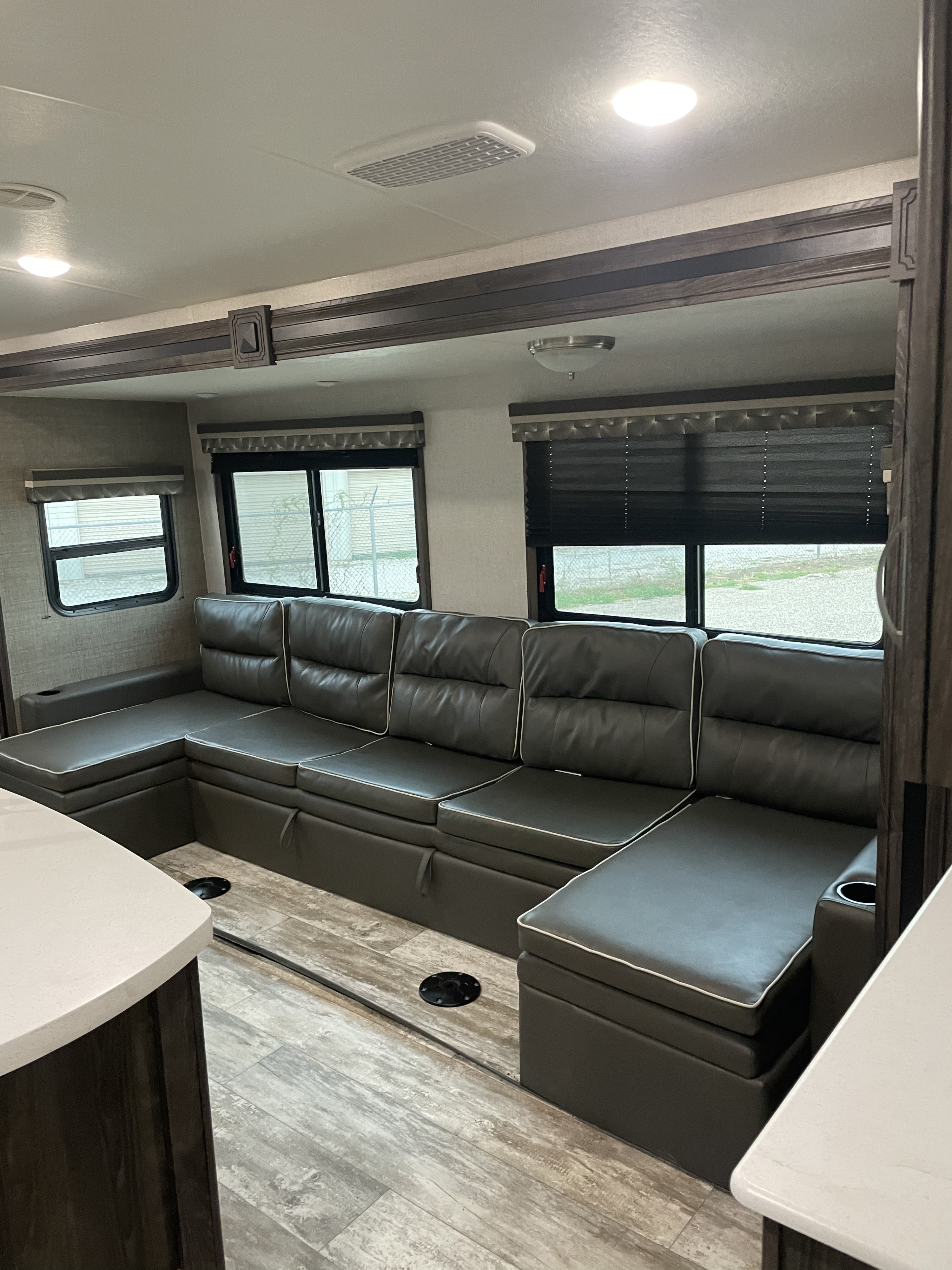 Sleeping and living area. Makes in your a bed. Lots of settings area in this RV. . Work and Play Work and Play Trailer 2020