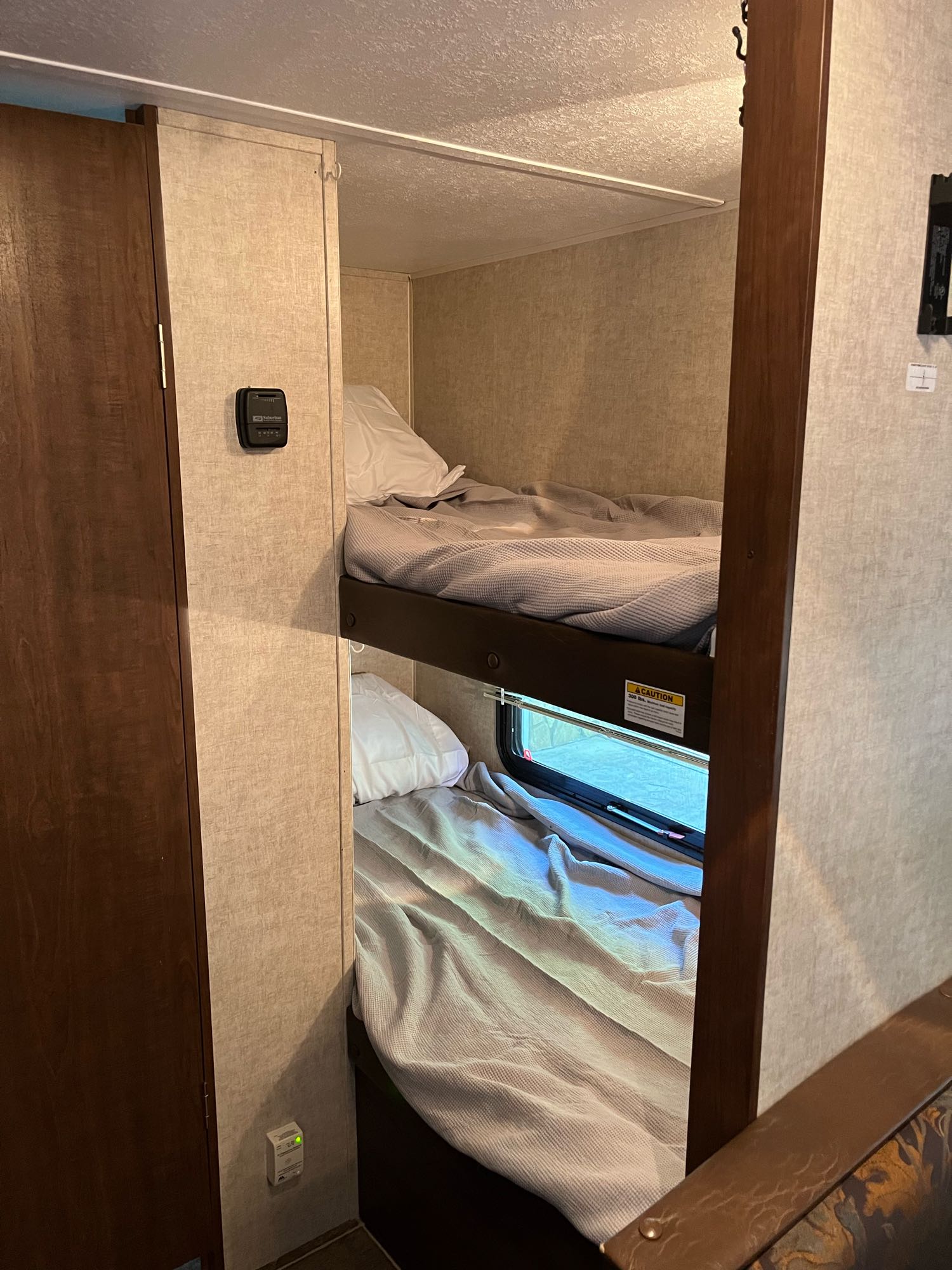 RV rental bunk beds: comfortable sleeping area with two bunks, a thermostat, and a window for family travel.. Keystone RV Hideout 175LHS 2015