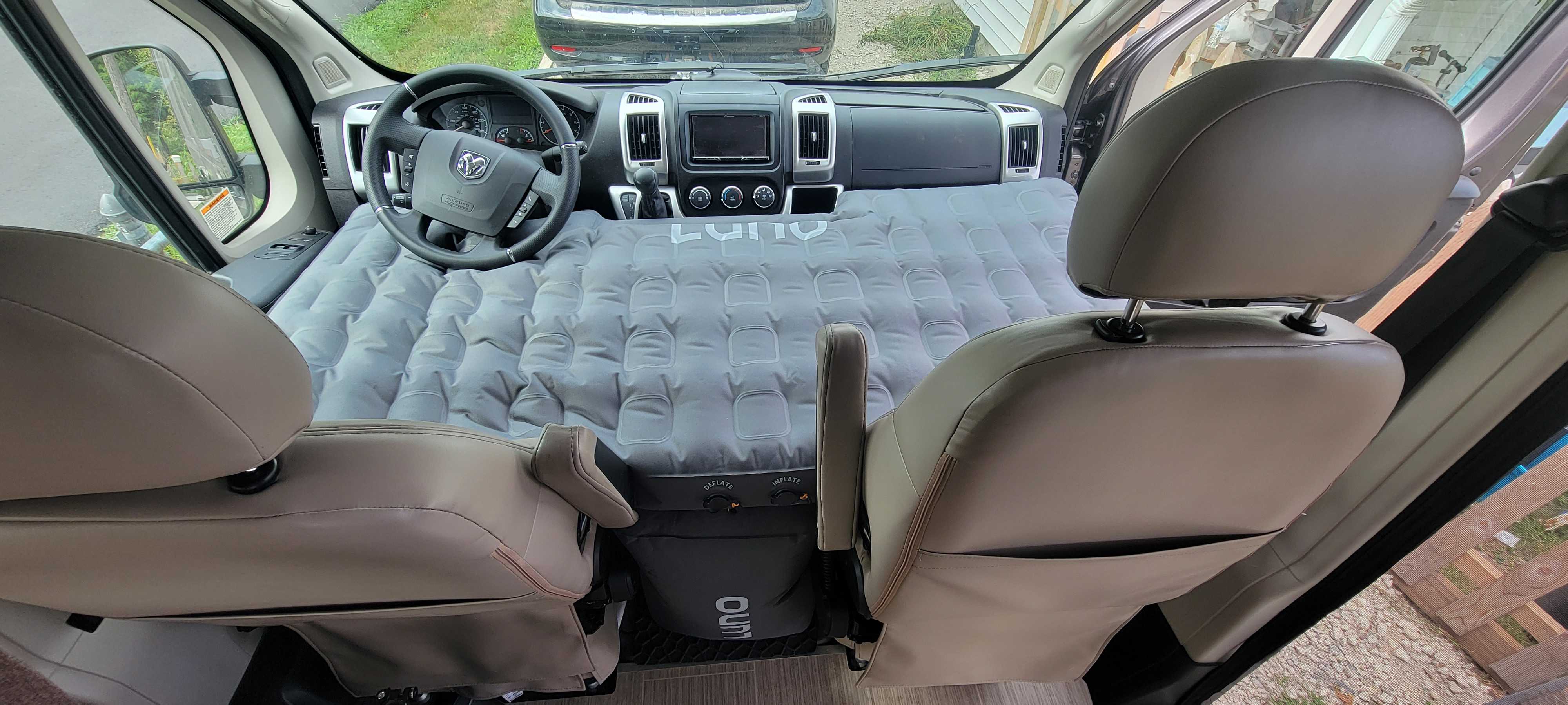 Inside an RV rental: a Luno air mattress seamlessly converts the front cabin into a cozy sleeping area for your next adventure.. Thor Scope 2022