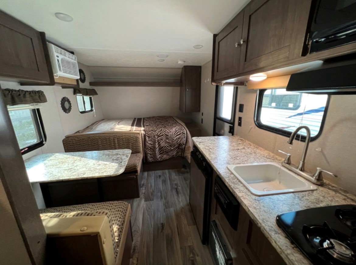 The queen is upgrade and the dinette converts into a twin. Keystone RV Hideout LHS Mini 2019
