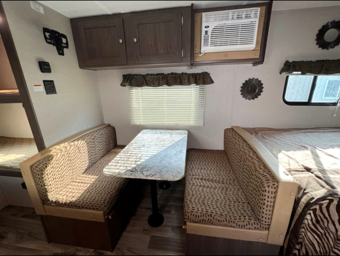 The A/C unit above the dinette will keep you cool!. Keystone RV Hideout LHS Mini 2019
