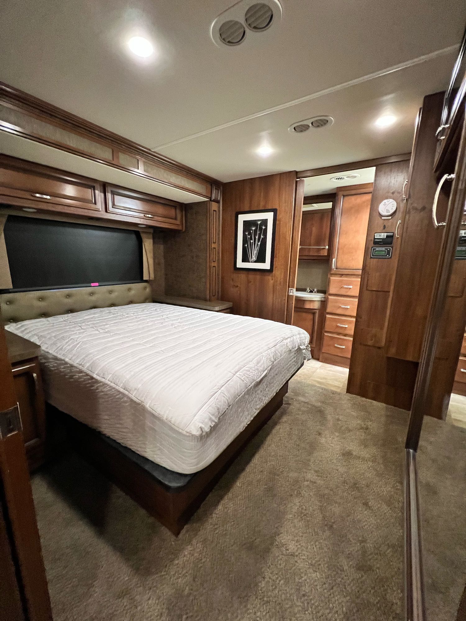 Master suite with a queen-size bed.. Fleetwood Bounder 2014