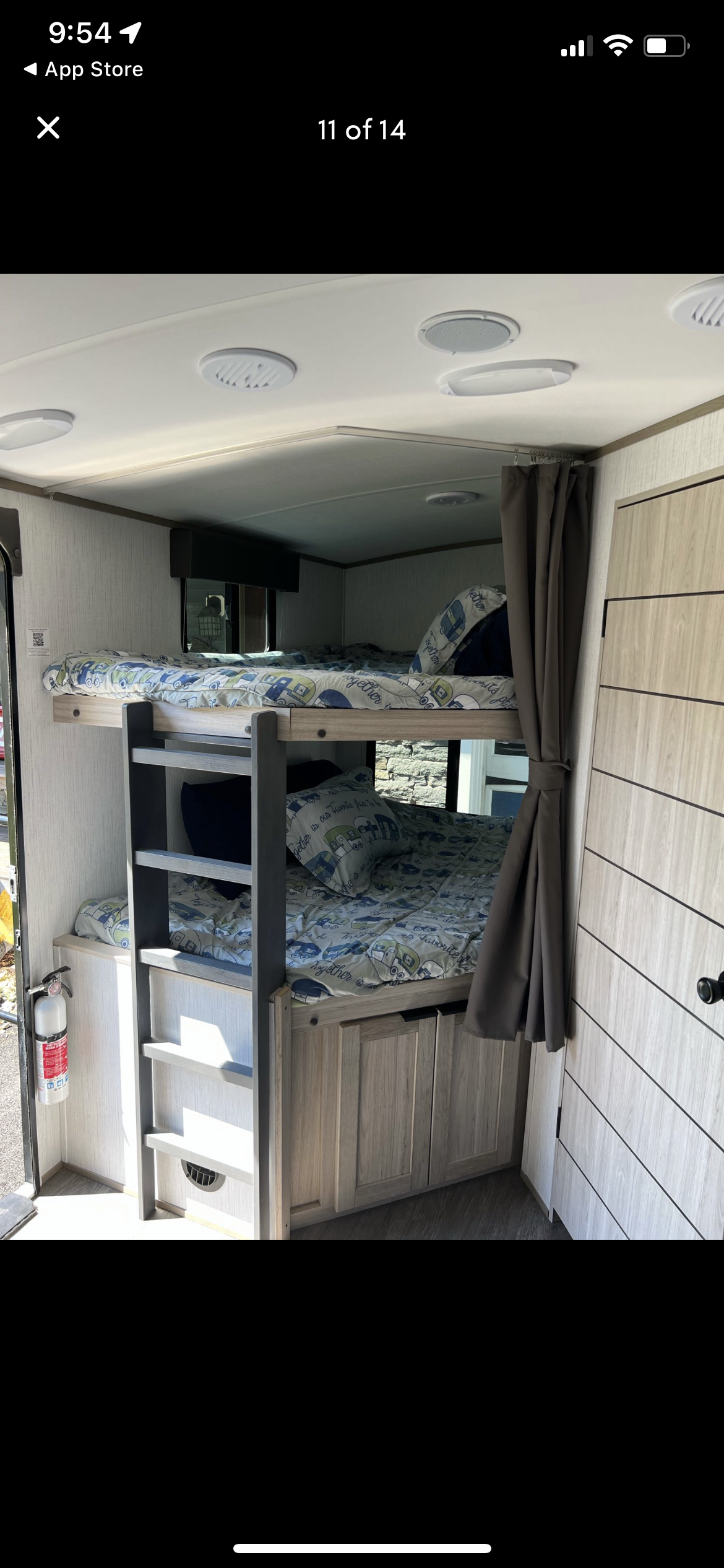 Cozy RV rental featuring stacked bunk beds with playful camper-themed bedding, practical storage, and a bright interior.. Shadow Trailers 277bhs 2022