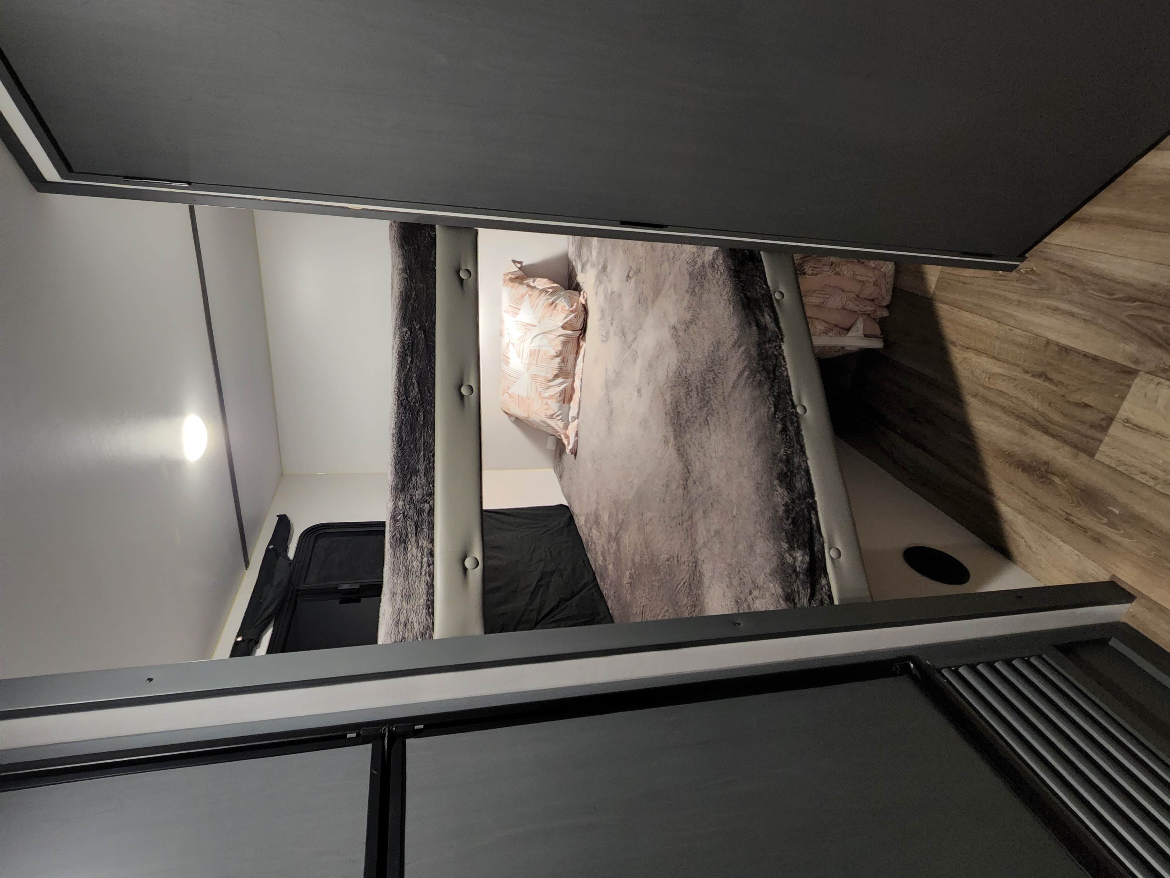 Cozy RV rental features modern bunk beds with plush bedding, bright lighting, and wood-look floors.. Keystone RV Bullet Crossfire 2022