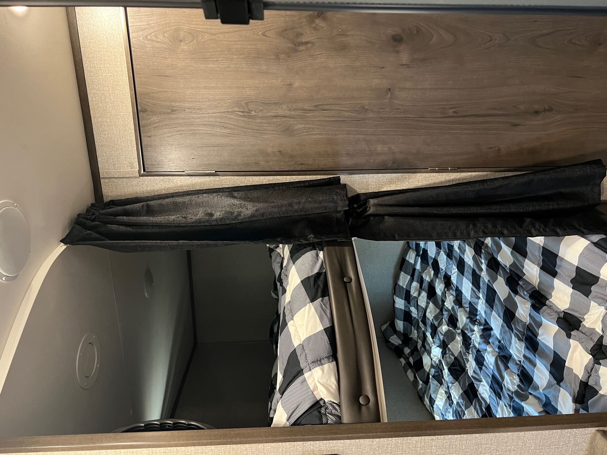 RV rental interior: cozy sleeping areas with black/white checkered bedding, privacy curtains, and wood accents.. Jayco Jay Flight SLX Rocky Mountain Edition 2021