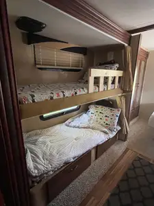 RV rental interior: View of cozy bunk beds, a comfortable sleeping area perfect for family road trips or adventures.. Jayco Greyhawk 2015