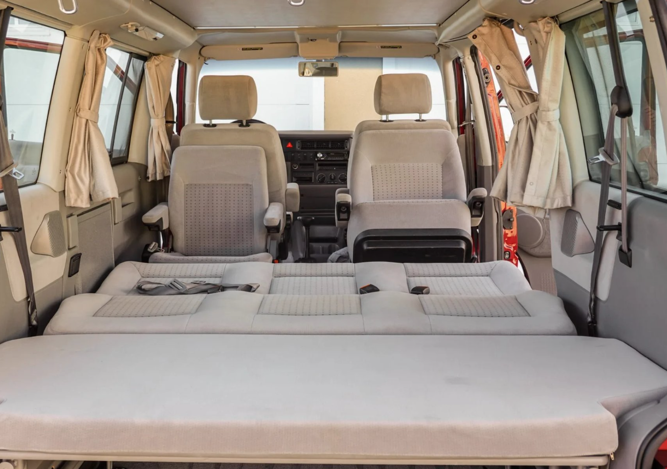 This RV rental features a clean, versatile interior with a convertible bed made from rear seats, plus front captain's chairs.. Volkswagen Other 2003