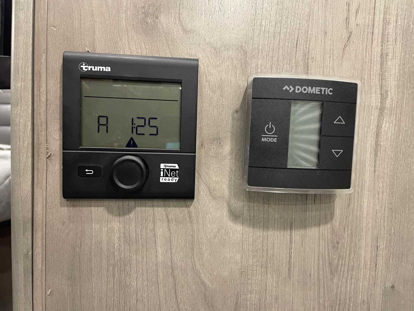 RV rental interior showing two key control panels: A Truma system with an "A 125" error and a Dometic climate control.. Coachmen Cross Trail 20CB 2022