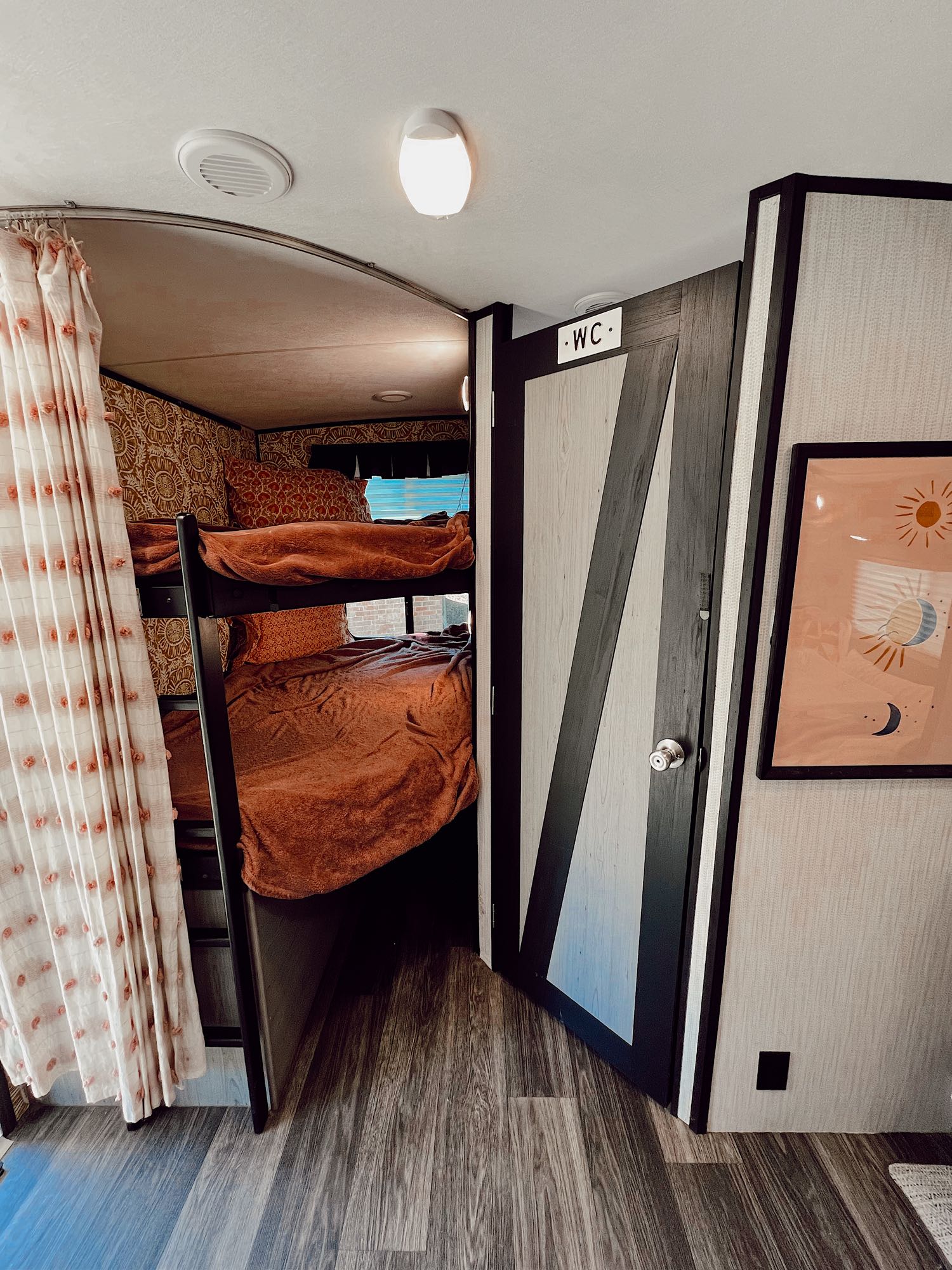 Twin XL bunks with custom interior walls. Features an accessible ladder & privacy curtain. Underneath storage is great for luggage bags or dog beds.. Heartland RVs Mallard 2021