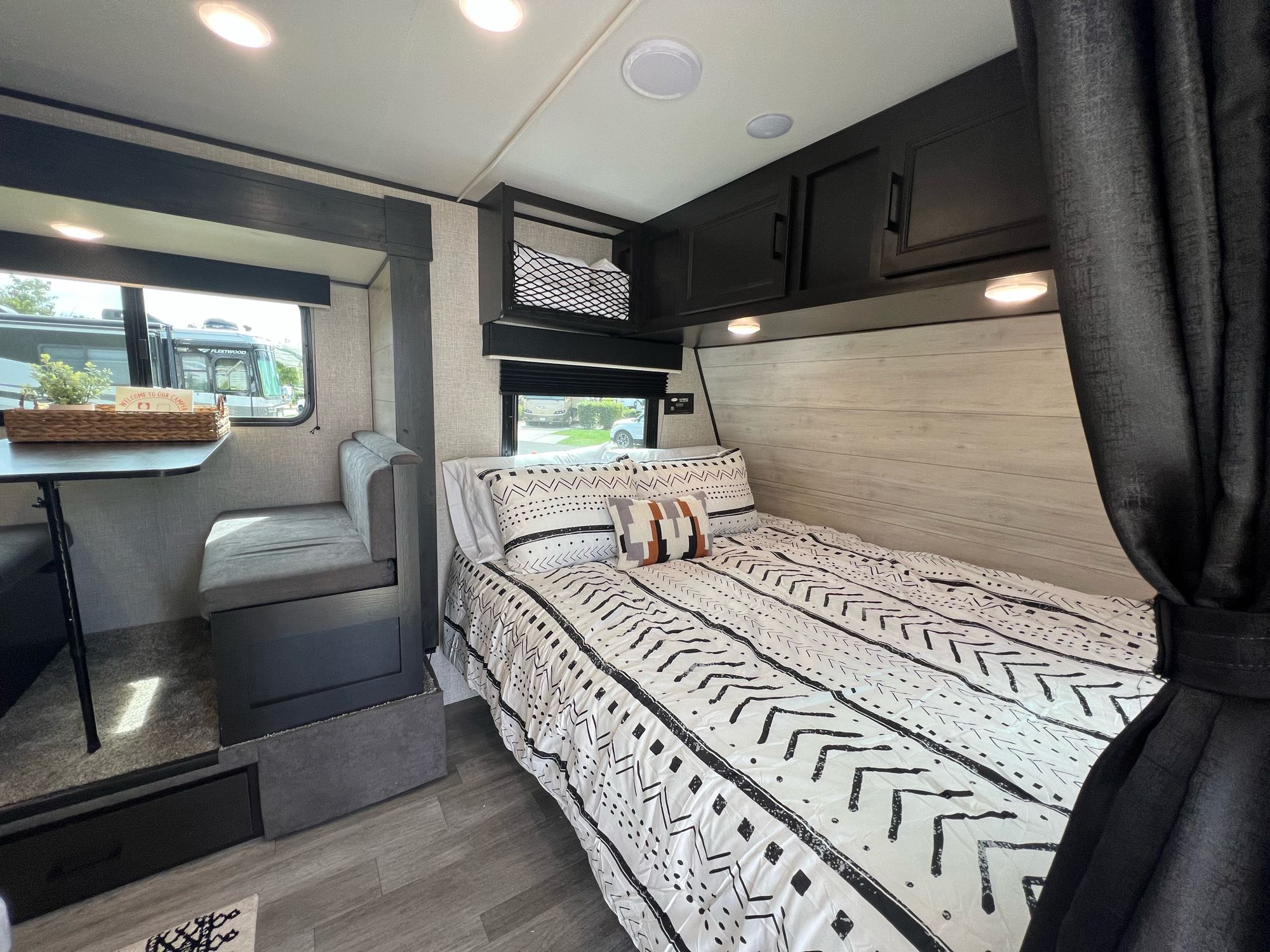 Spacious rv rental interior featuring a comfy bed, dinette, and storage. Ideal for travel.. Jayco Jay Flight 2022