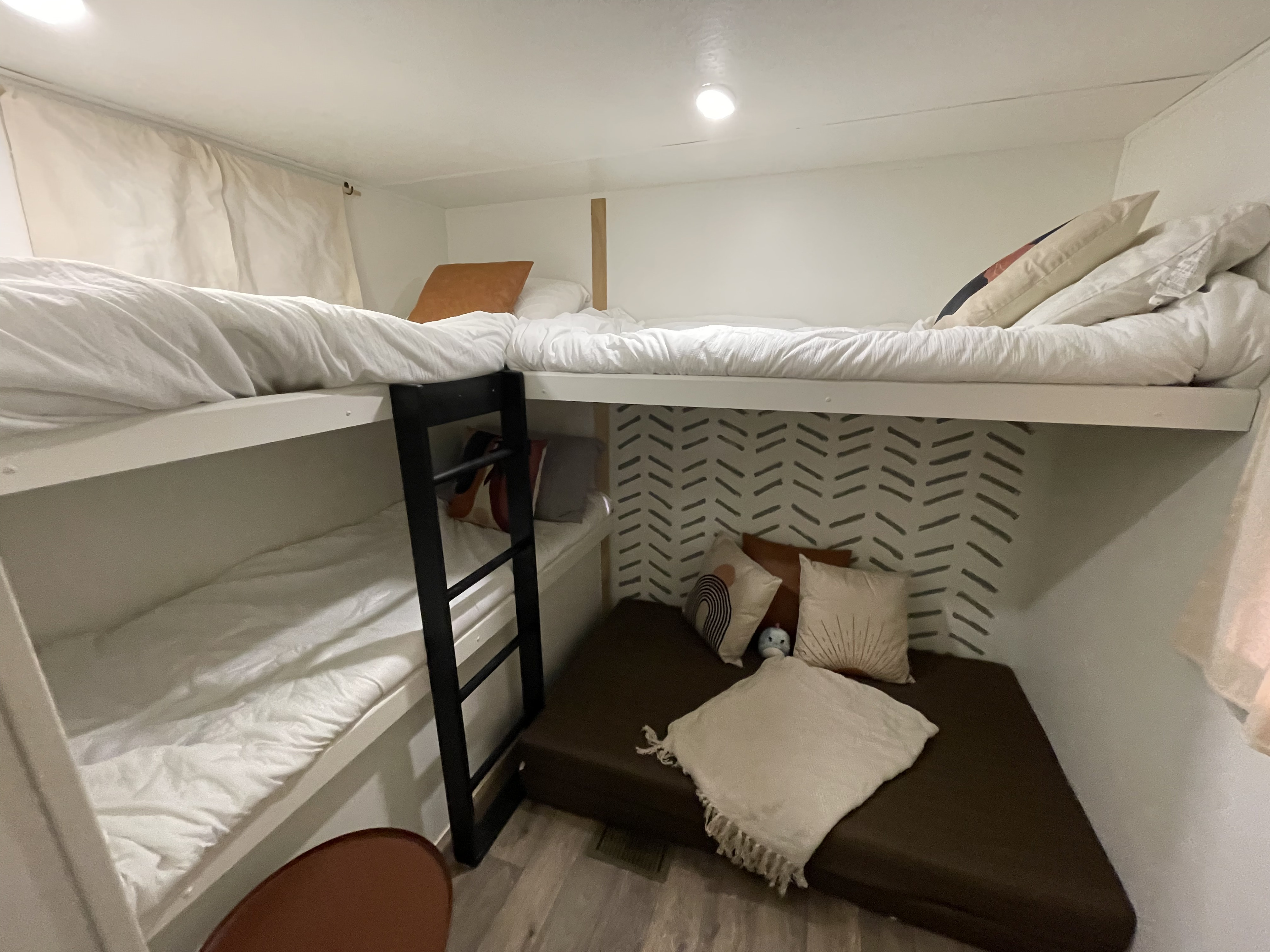 Bunk room with 3 bunks and 2 vibe cubes. . Forest River Vibe Extreme Lite 2018