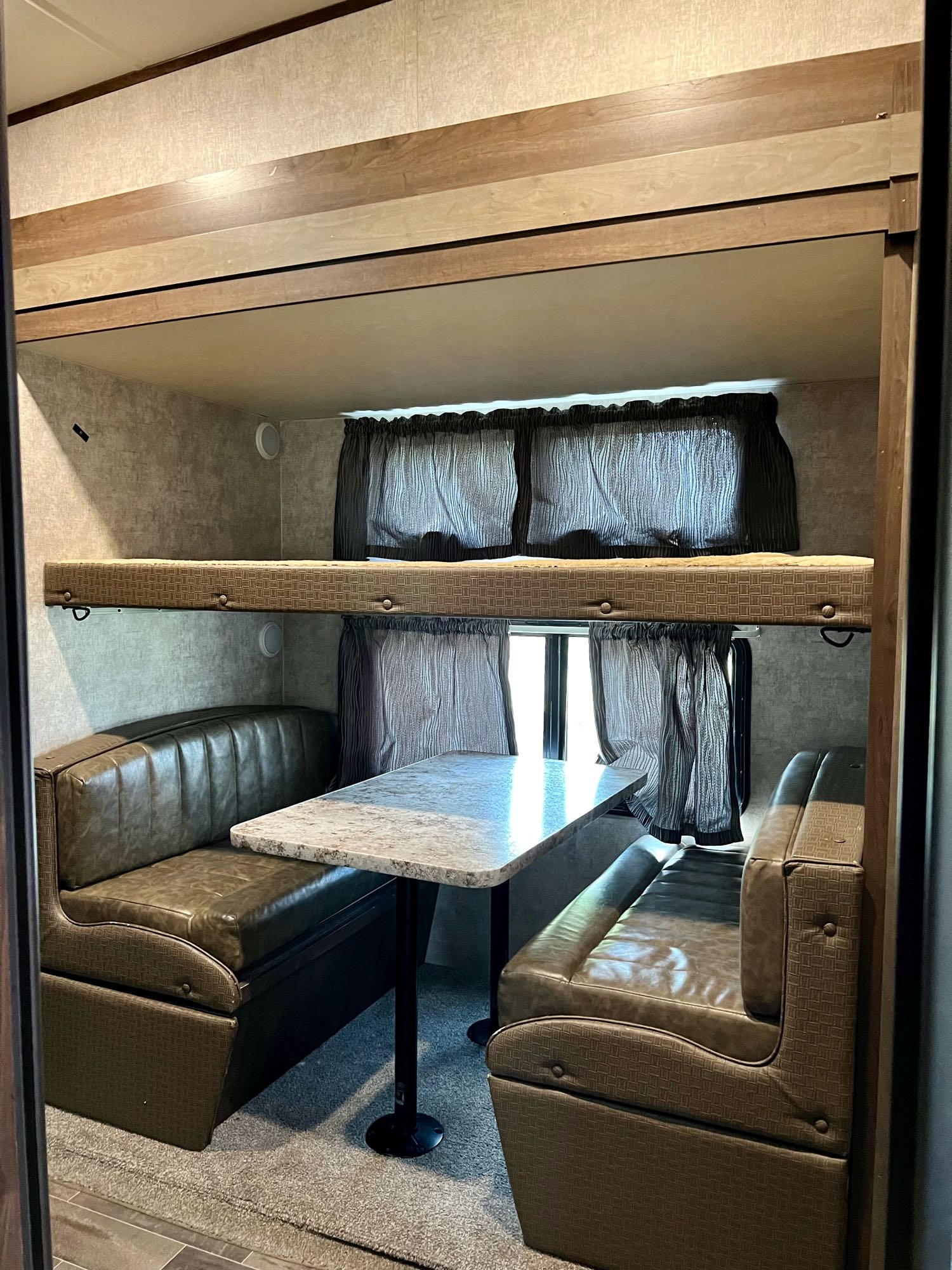 Bunk room with folding bunk and dinette table that makes into a twin.. Highland Ridge RV Roamer 2017