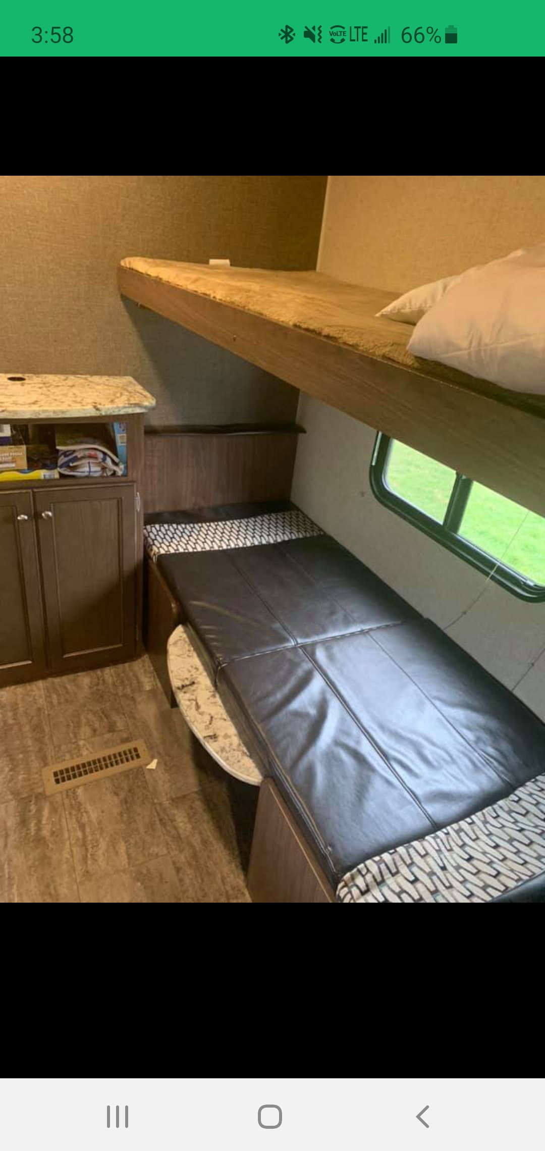 This RV rental's interior features comfortable bunk beds, a lower convertible sleeping area, and a functional storage cabinet.. Heartland RVs Trail Runner SLE 2018