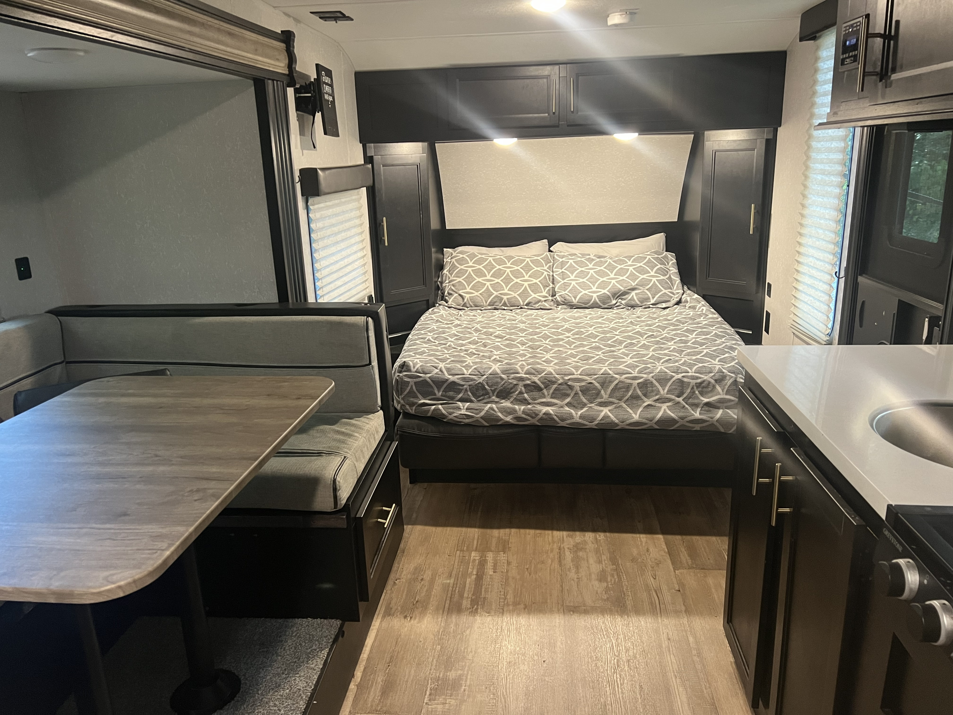 Queen bed w/ 2" added memory foam topper for comfy nights. Forest River Cherokee Grey Wolf Black Label 2021