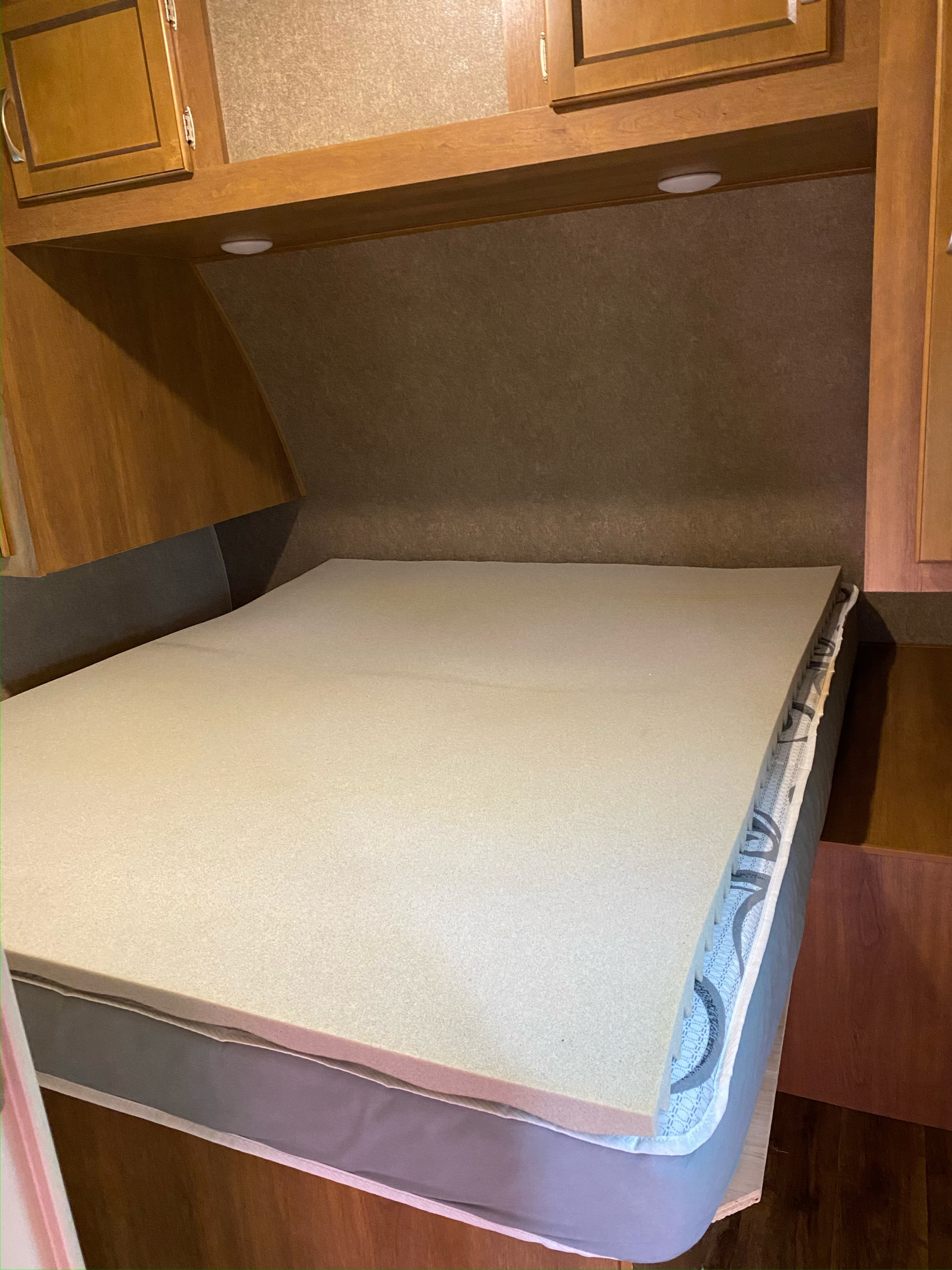 RV rental sleeping area showing mattress with foam topper & wooden cabinetry.. Coachmen 5ZT2CAUB5JU029455 2018