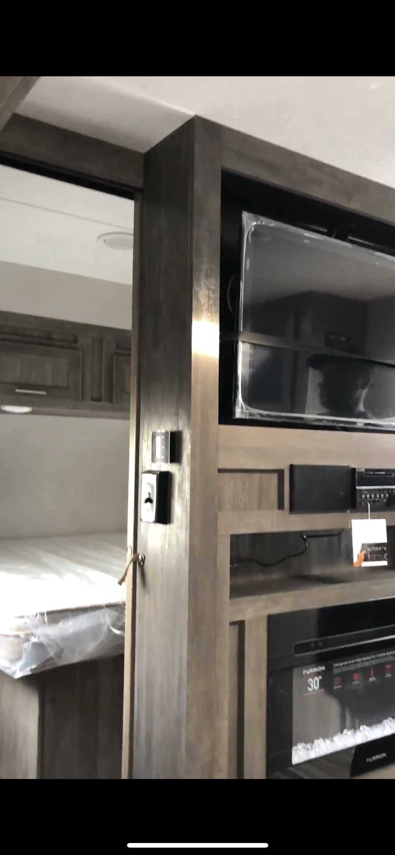 This RV rental features a new bunk sleeping area and an entertainment center with a TV and 30" electric fireplace.. Forest River Vibe 2019