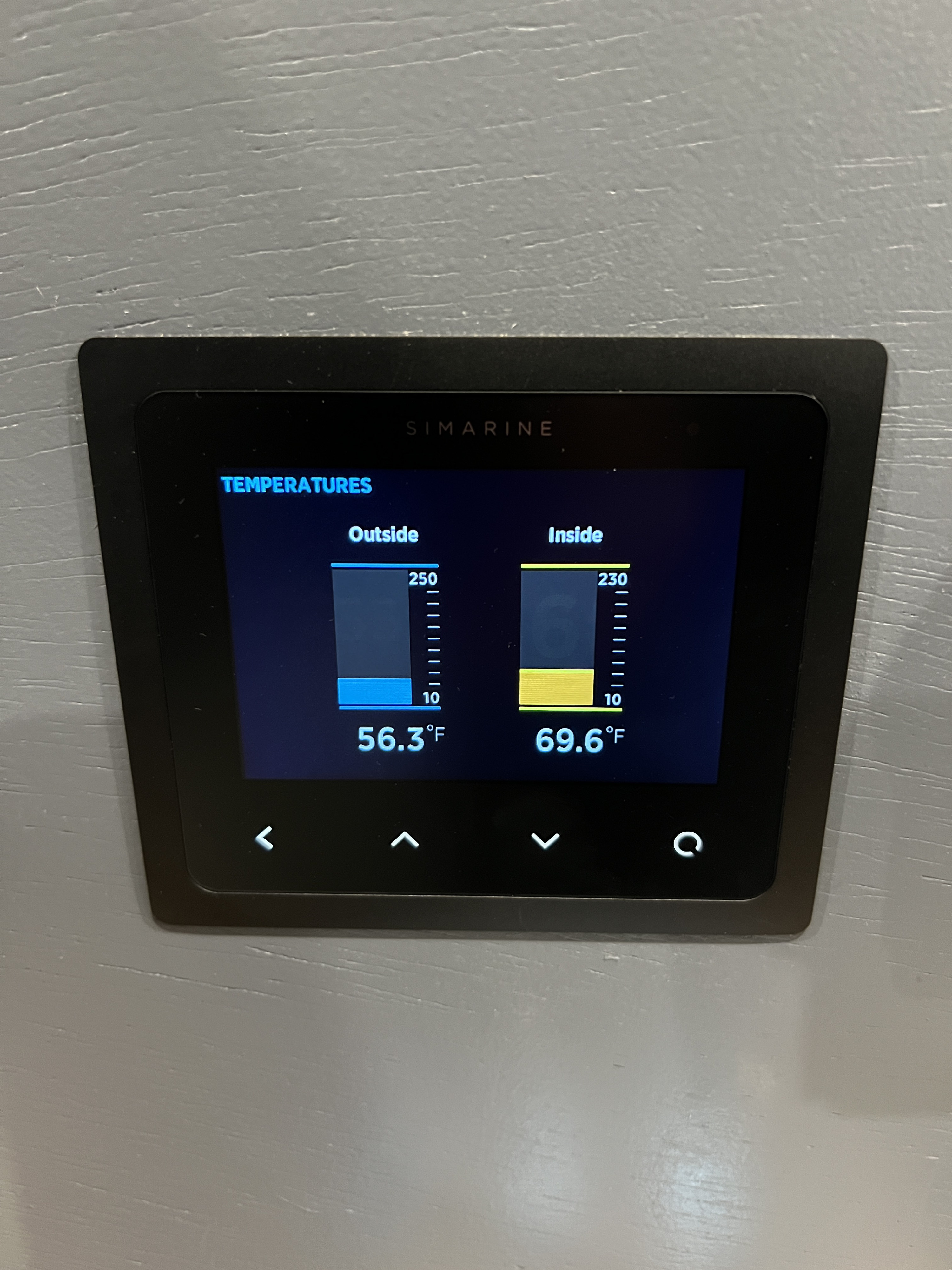 RV rental's Simarine digital display shows inside (69.6°F) and outside (56.3°F) temperatures for monitoring comfort.. Dodge Sprinter 2014
