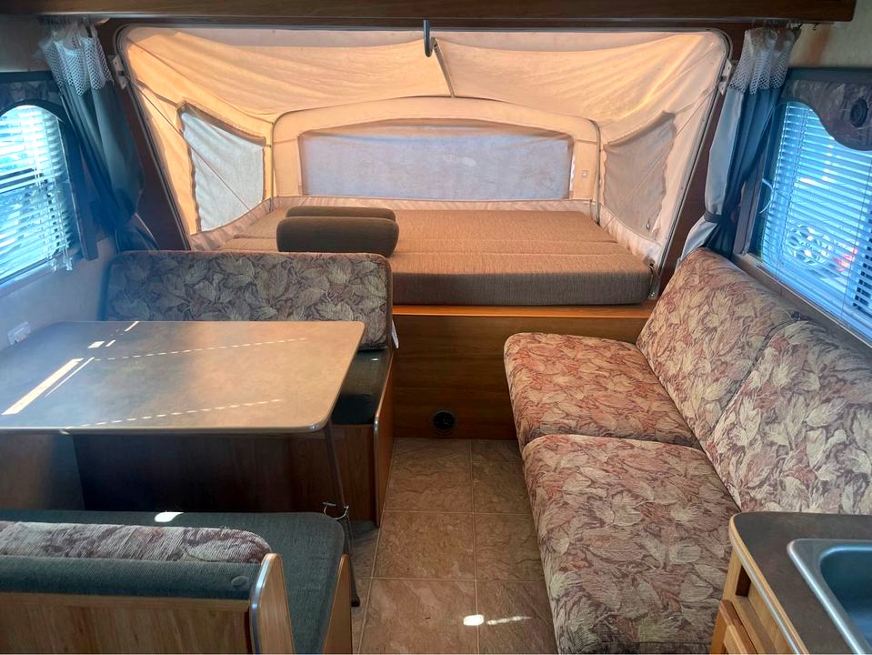 Queen sized bed on the fold out platform with zippered windows all around. Both the dinette table and couch make a double bed each.. R-Vision Trail-Lite Trail-Cruiser 2007