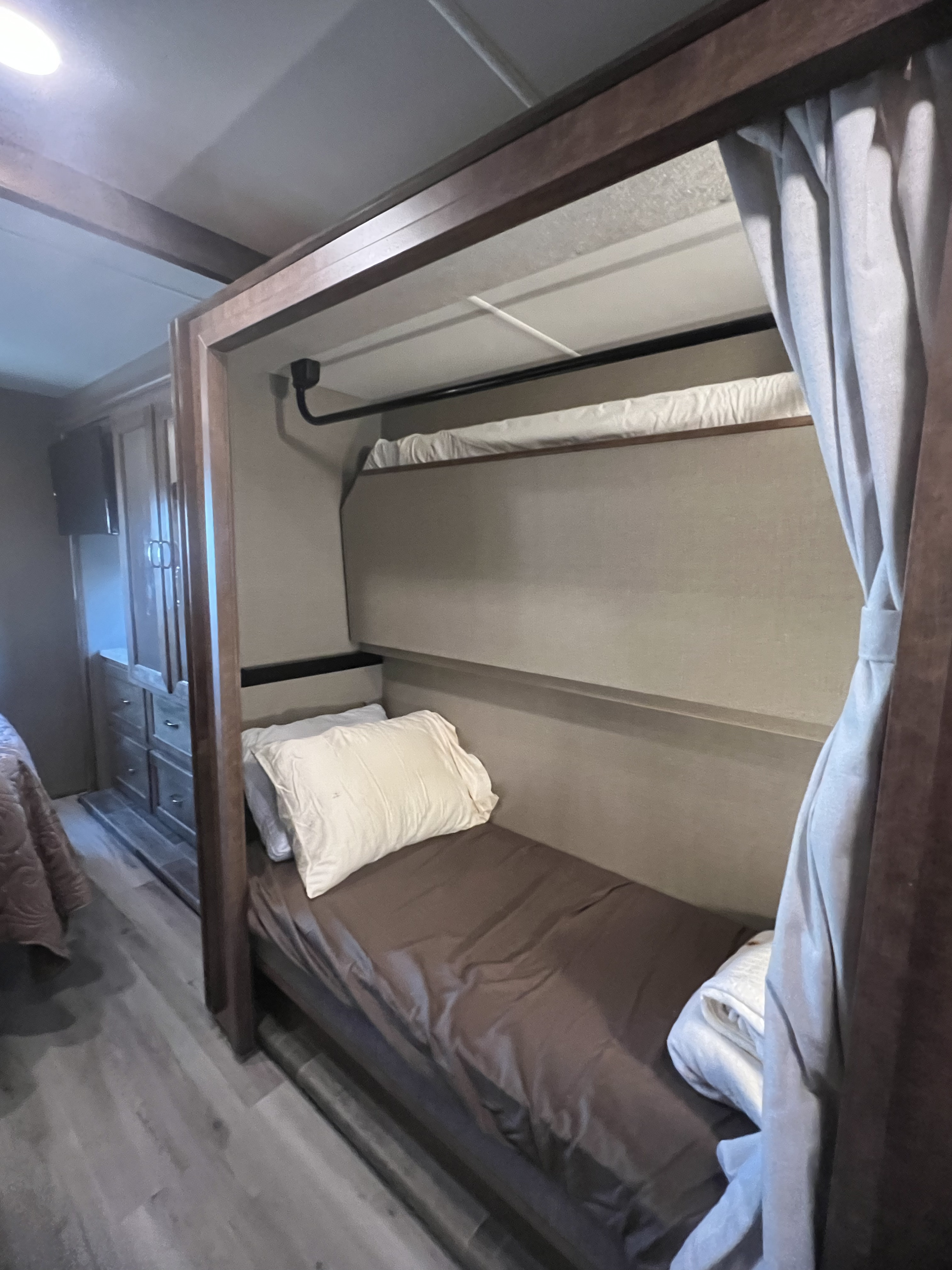 RV rental interior with comfortable bunk beds & curtains. Ideal for family travel.. Winnebago Other 2018