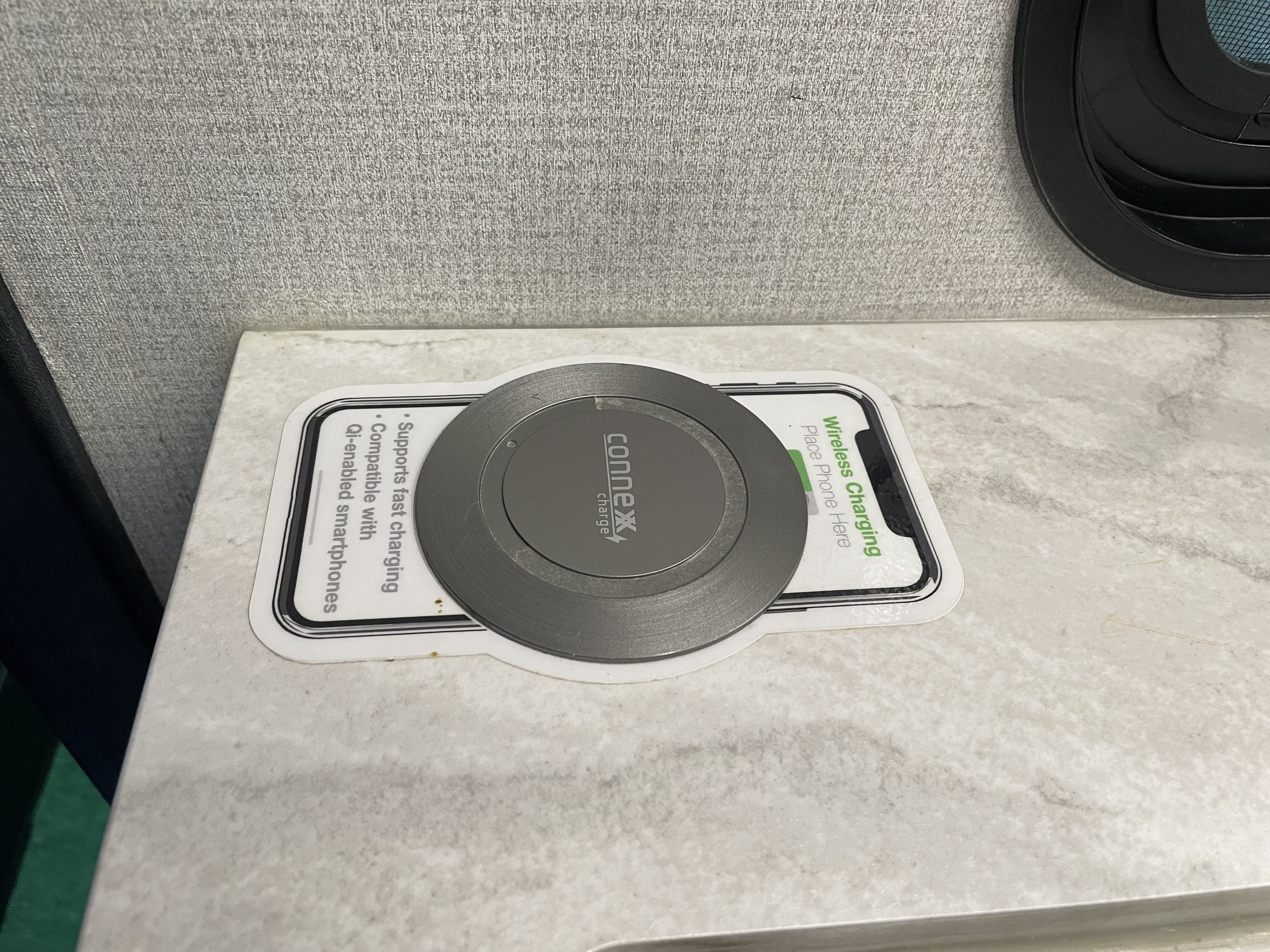 Wireless phone charger for Qi-enabled smartphones on an RV rental countertop, offering fast charging.. Forest River Sunseeker 2850SLE 2023