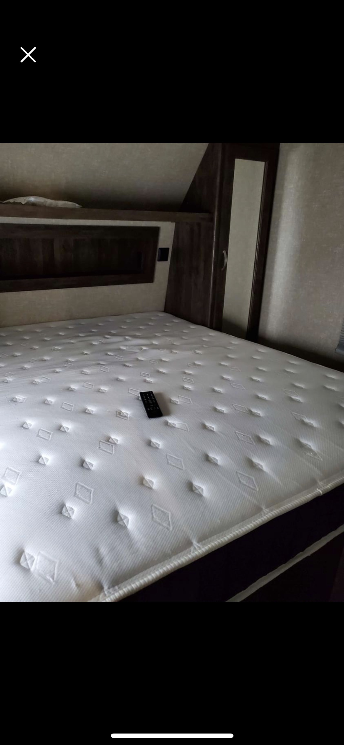 RV rental bedroom features: new white mattress, remote control, built-in storage. Ideal for a comfortable stay.. Forest River Vibe 2017