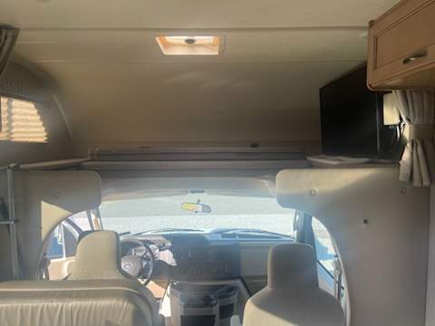 Sleeping space over the cab is accessed by a small ladder. The Smart TV swings out.. Thor Freedom Elite 2018
