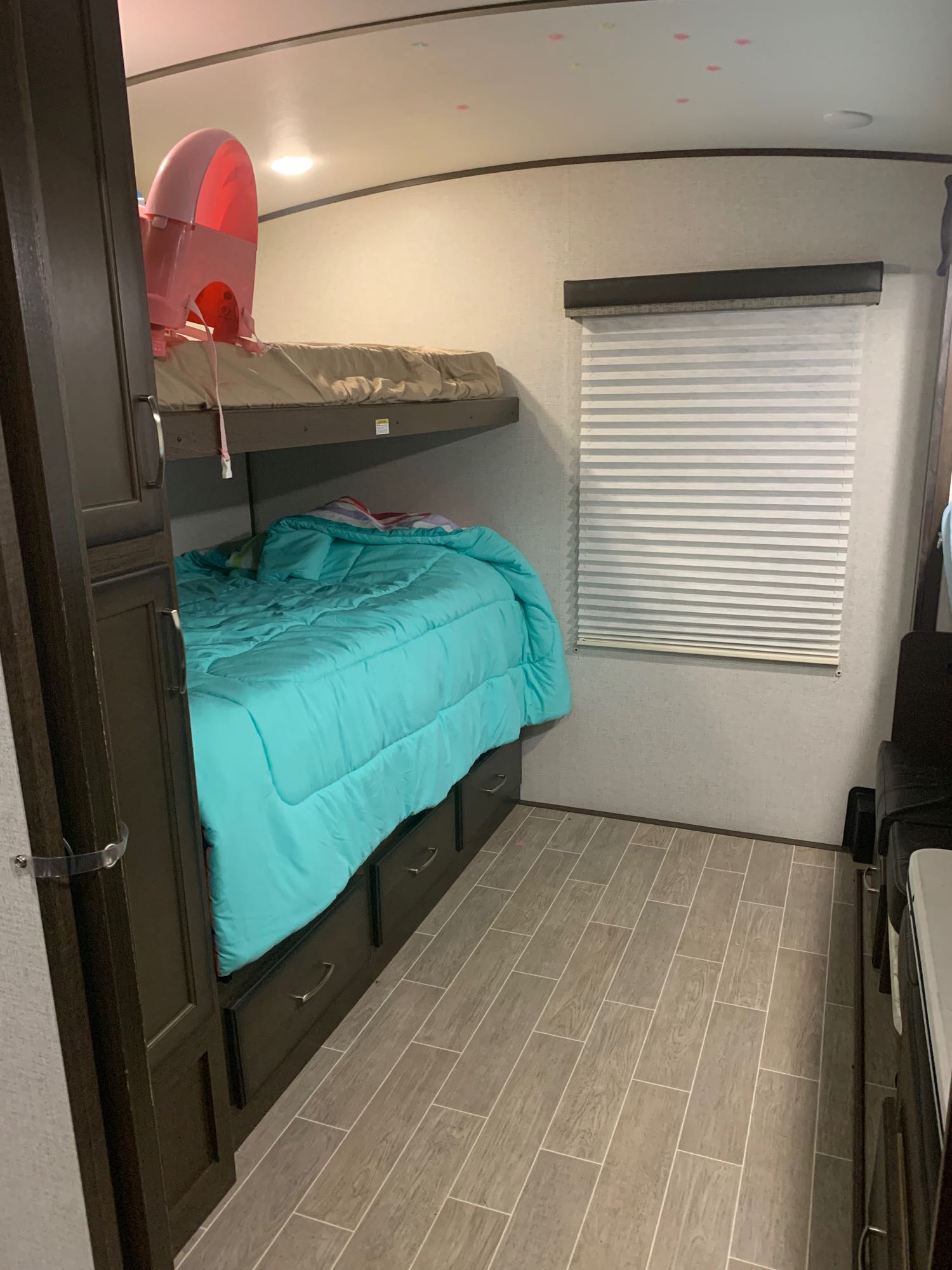 2/4 beds in the bunk house this room has 2 closets and 8 pull out drawers each bunk has a USB port for phone or tablet charging . Dutchmen Atlas 2019