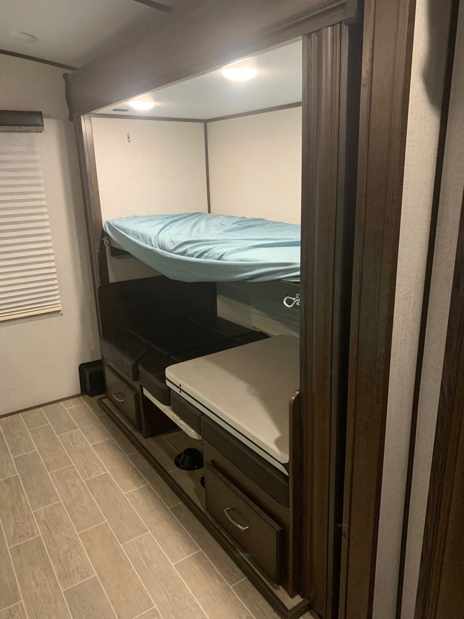 2/4 bunks in the bunk house and the folding table that’s included in the rental . Dutchmen Atlas 2019
