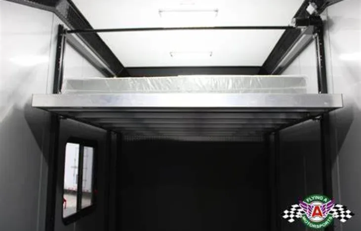 This RV rental's versatile toy hauler interior features an elevated bunk above a large cargo space for gear.. Look Moab Slickrock 2023