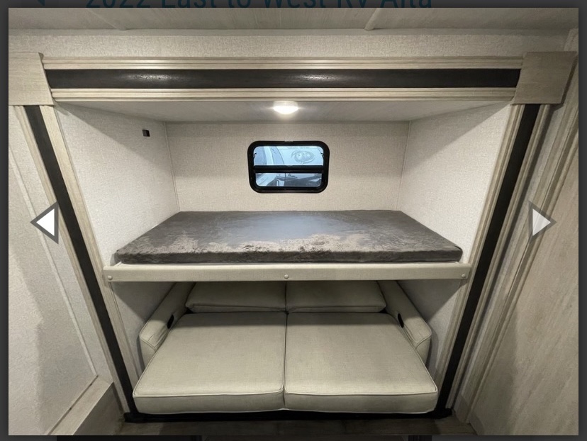 RV rental bunkhouse: Features a comfy top bunk and a lower convertible sofa for versatile family sleeping options.. East to West Alta 2022