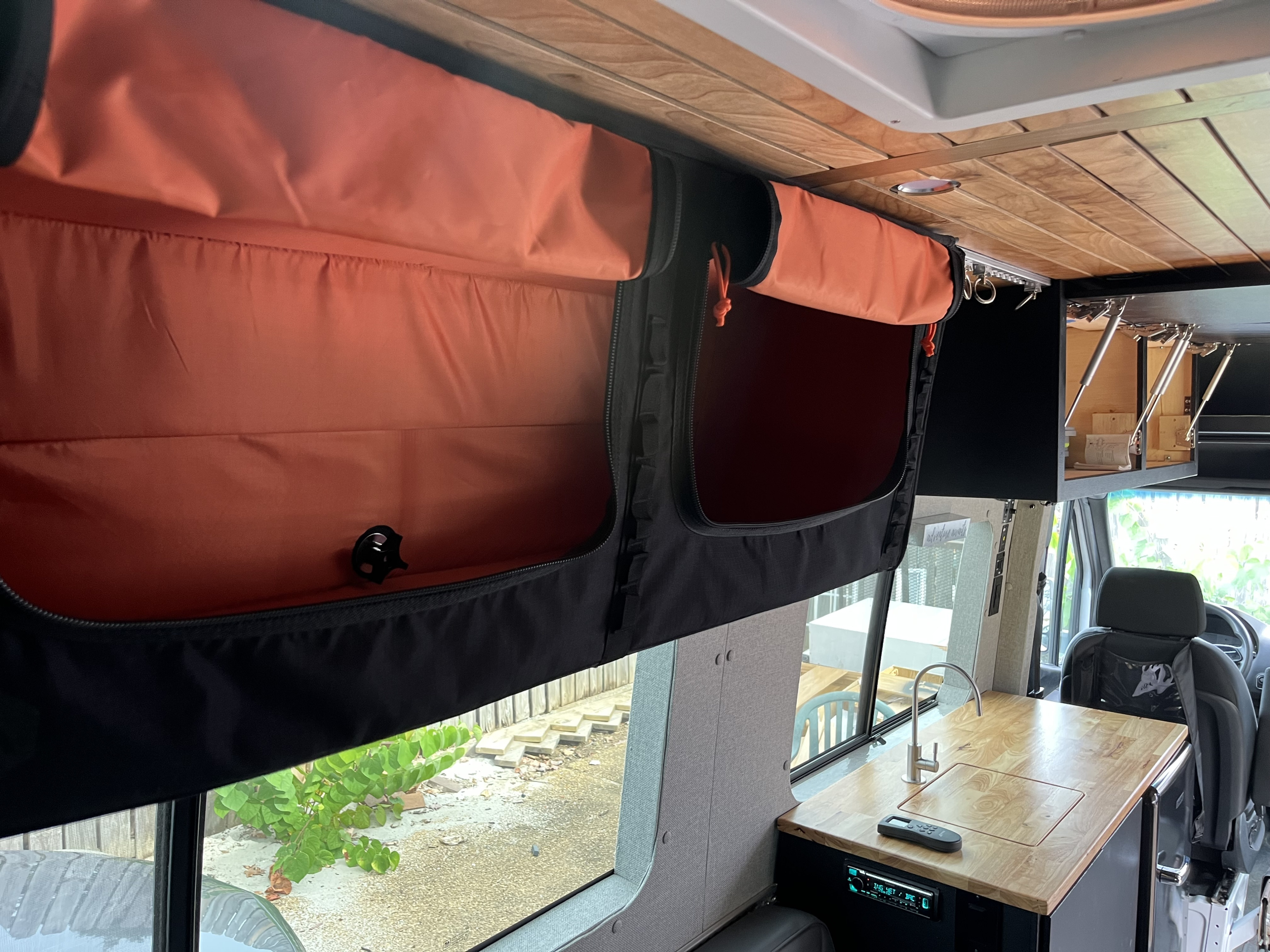 RV rental with clever storage! Features soft overhead bins, a wooden ceiling, and a kitchenette. Ready for travel.. Mercedes Sprinter 2019