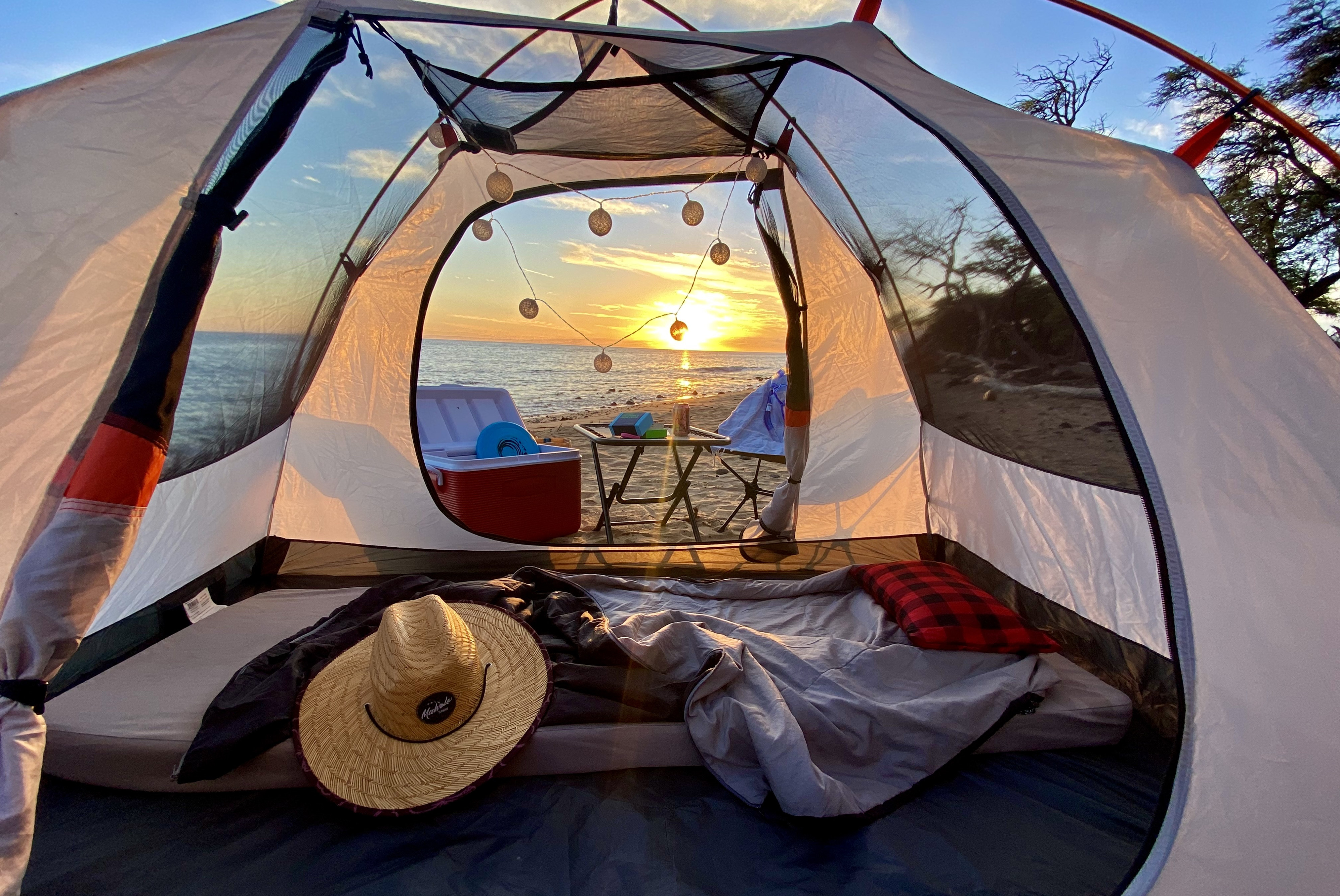 View from inside a cozy tent at sunset over the beach. String lights, cooler, bedding. Perfect for camping or an rv rental trip.. Nissan PRIMASTAR 2013