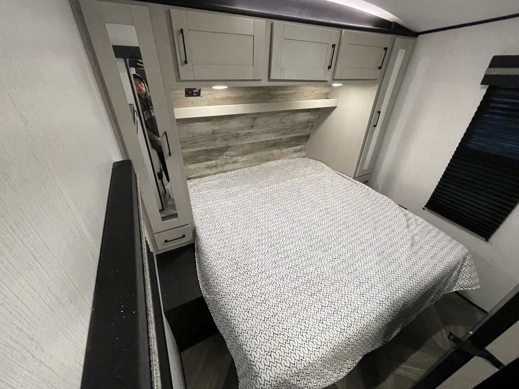 Master bedroom with king-sized bed. Separated by it's own sliding door.. Heartland Torque 2022