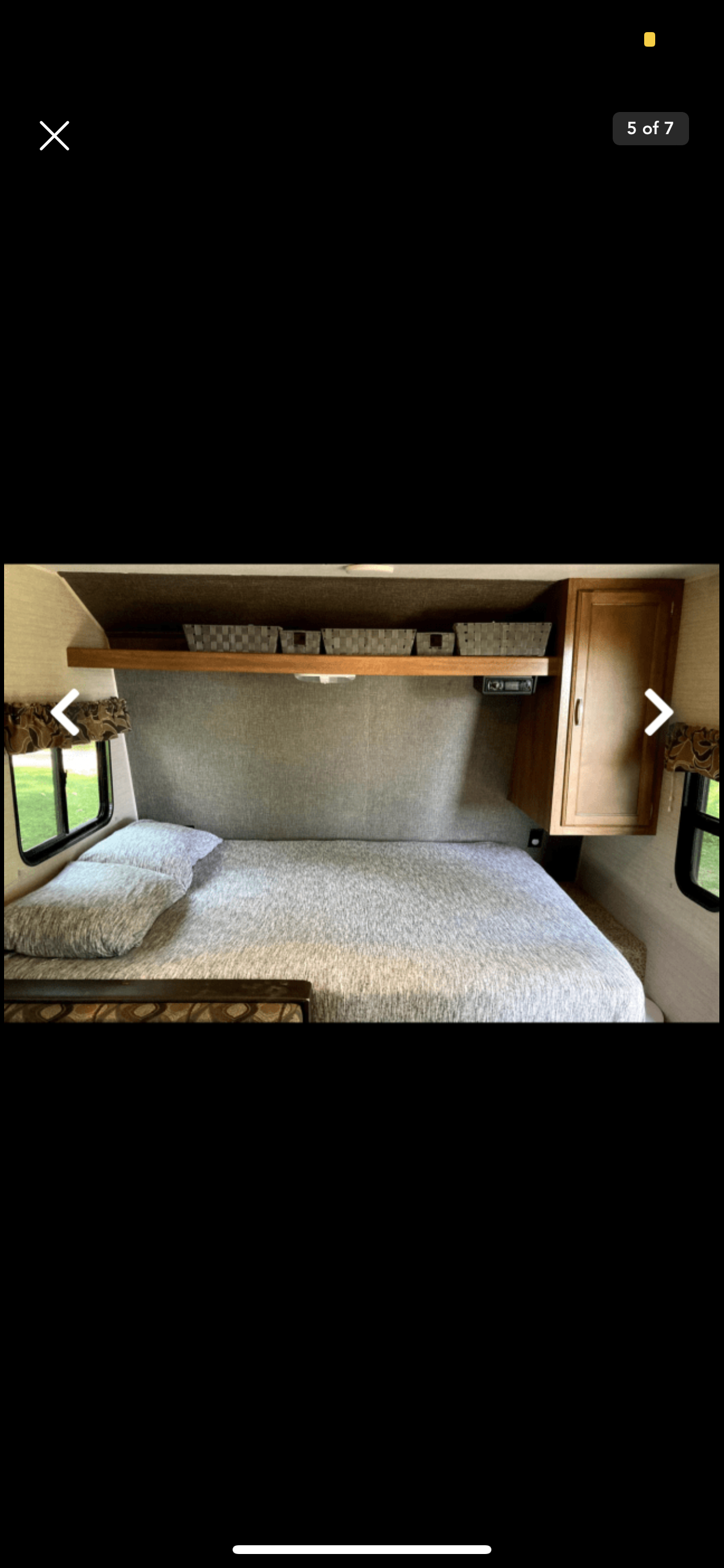 This RV rental bedroom offers a comfortable bed, convenient overhead storage, and a window for natural light.. Keystone RV Summerland Mini 2016
