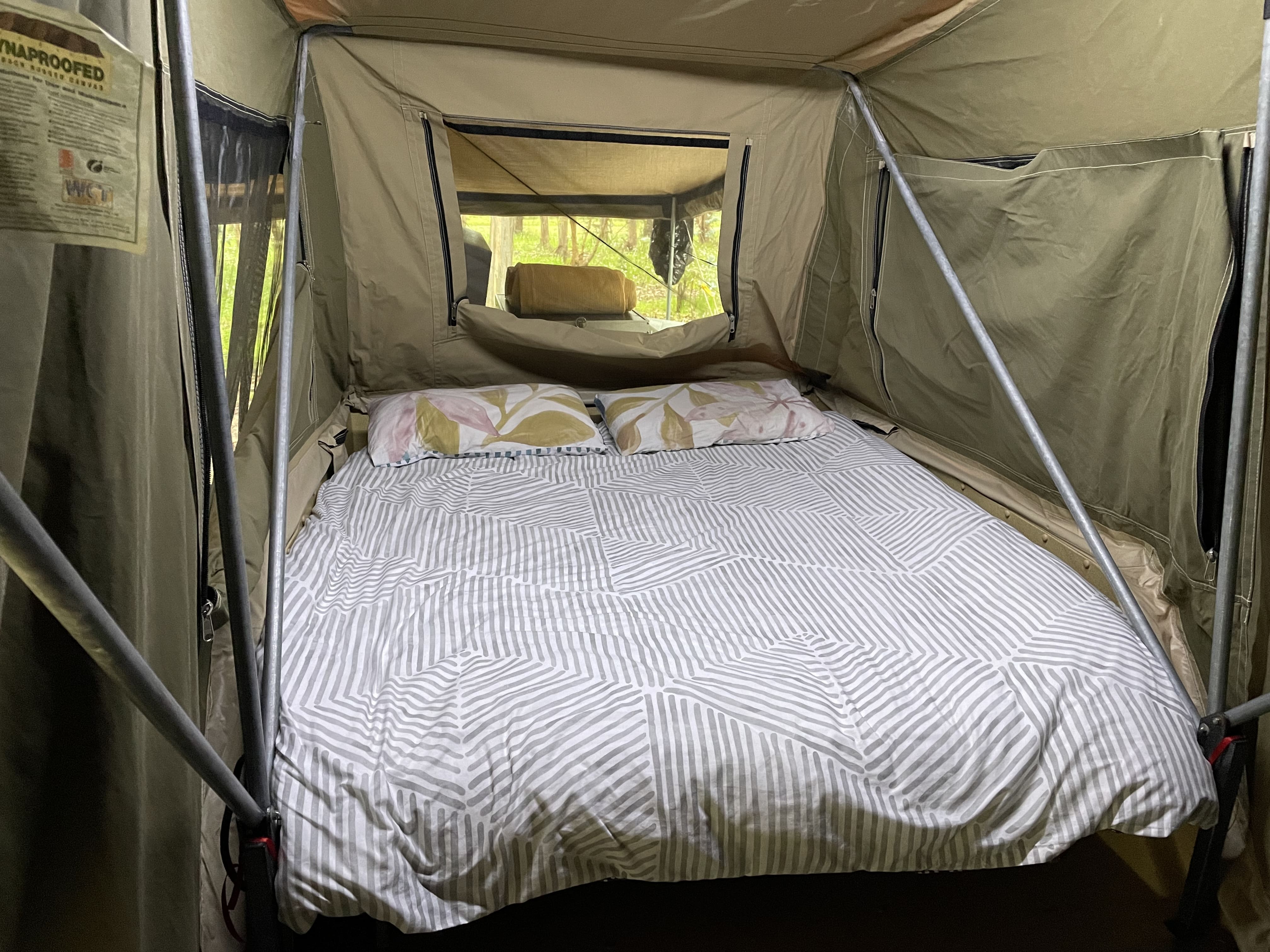 Cozy rooftop tent bed setup, perfect for your next RV rental adventure.. Kimberley Kampers Kamper Platinum 2006