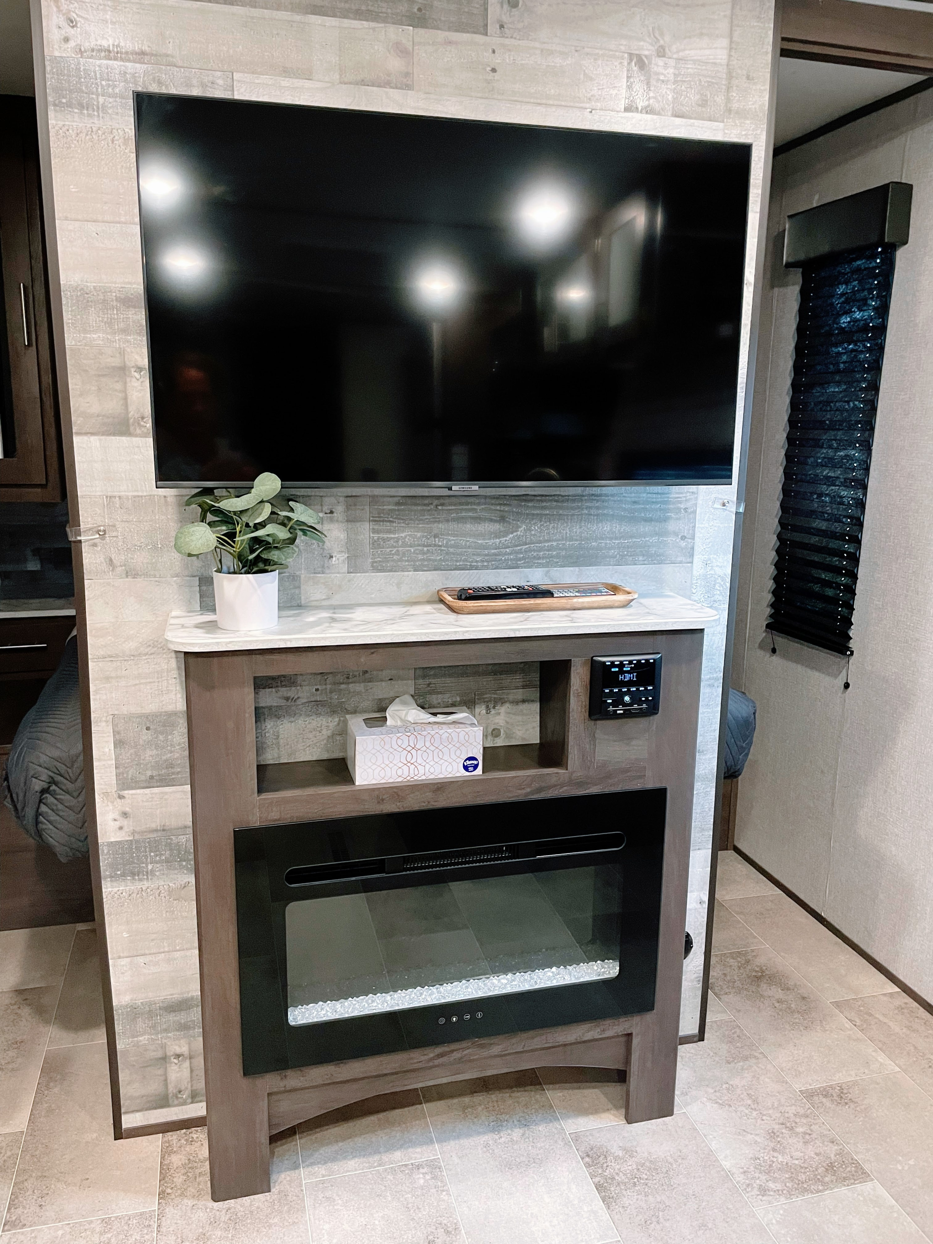 Brand new 43" 4K LED TV with all the input sources set above a nice electric fireplace. . Dutchmen Coleman 334BH 2021