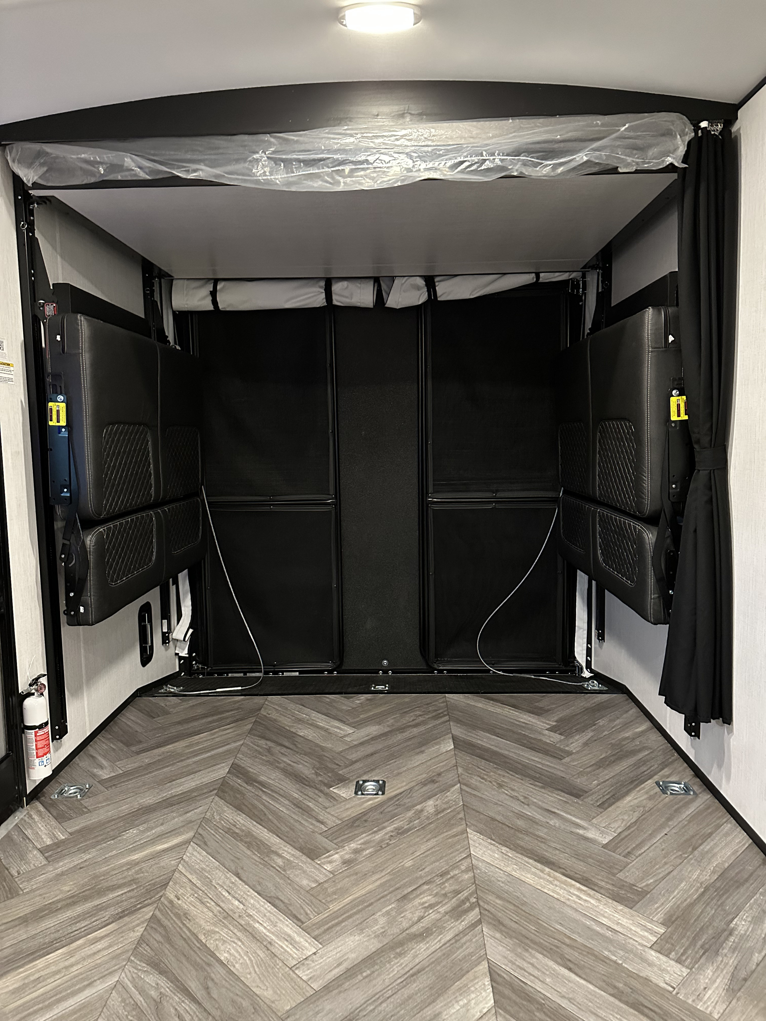 This RV rental offers a versatile toy hauler rear with fold-up seating, cargo tie-downs, and herringbone flooring.. Heartland Torque 2023