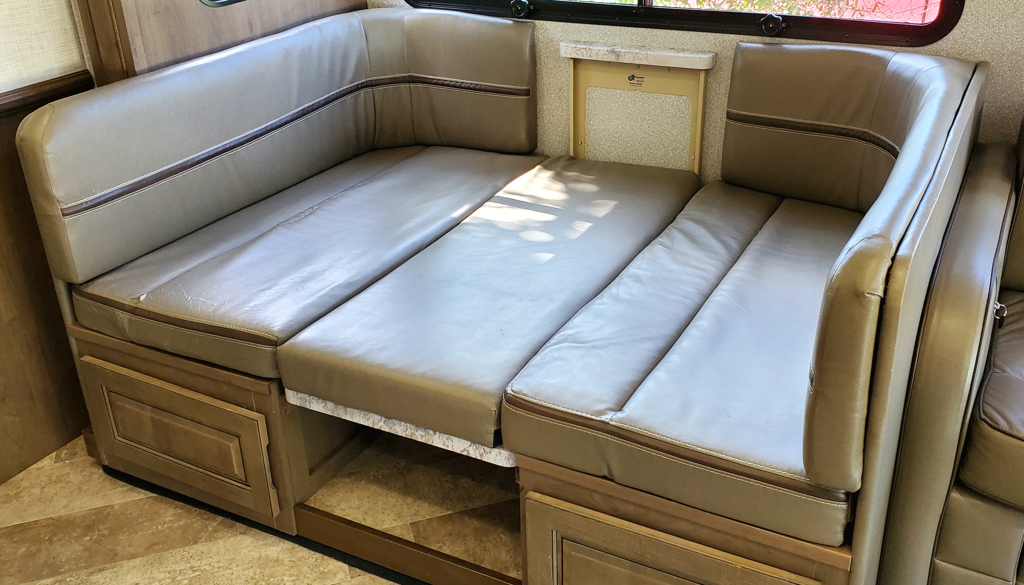 This RV rental features a convertible dinette area, easily transforming into a spacious bed. Ideal for comfortable travel.. Georgetown GT5 2019