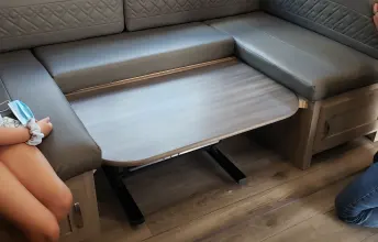 Dining set down in place for sleeping.  Remove padded pillows on backing and lay down on table.  Sleeps another one or two smalls.. Freedom Express Ultra Light Coachmen RV 2021